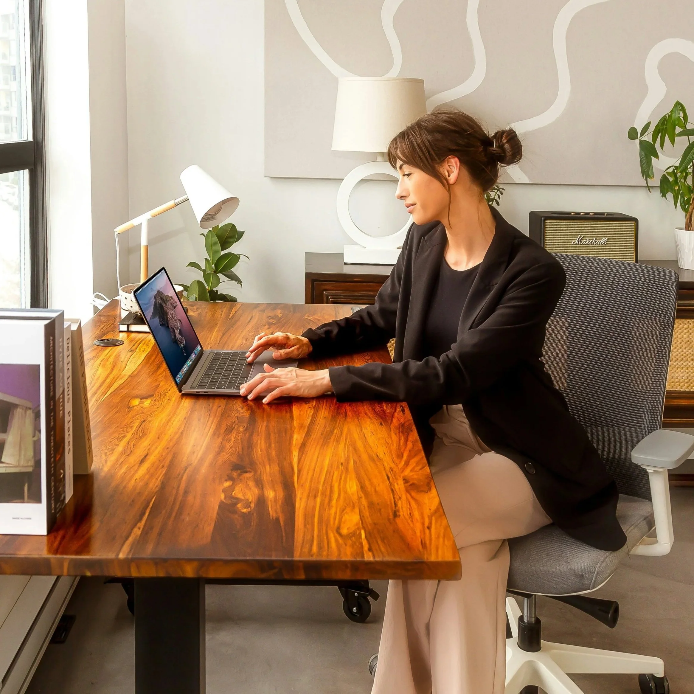 personal assistant reviewing daily schedule on laptop