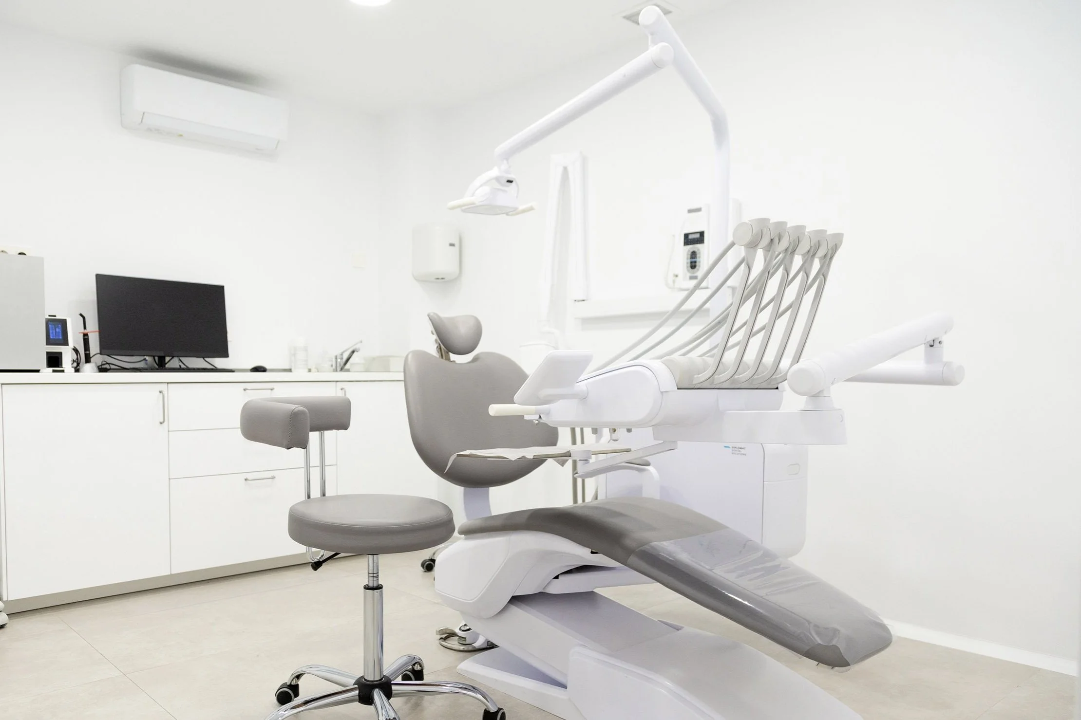 Argyll Dental's modern op room. Modern dental office with chair, equipment, and computer.