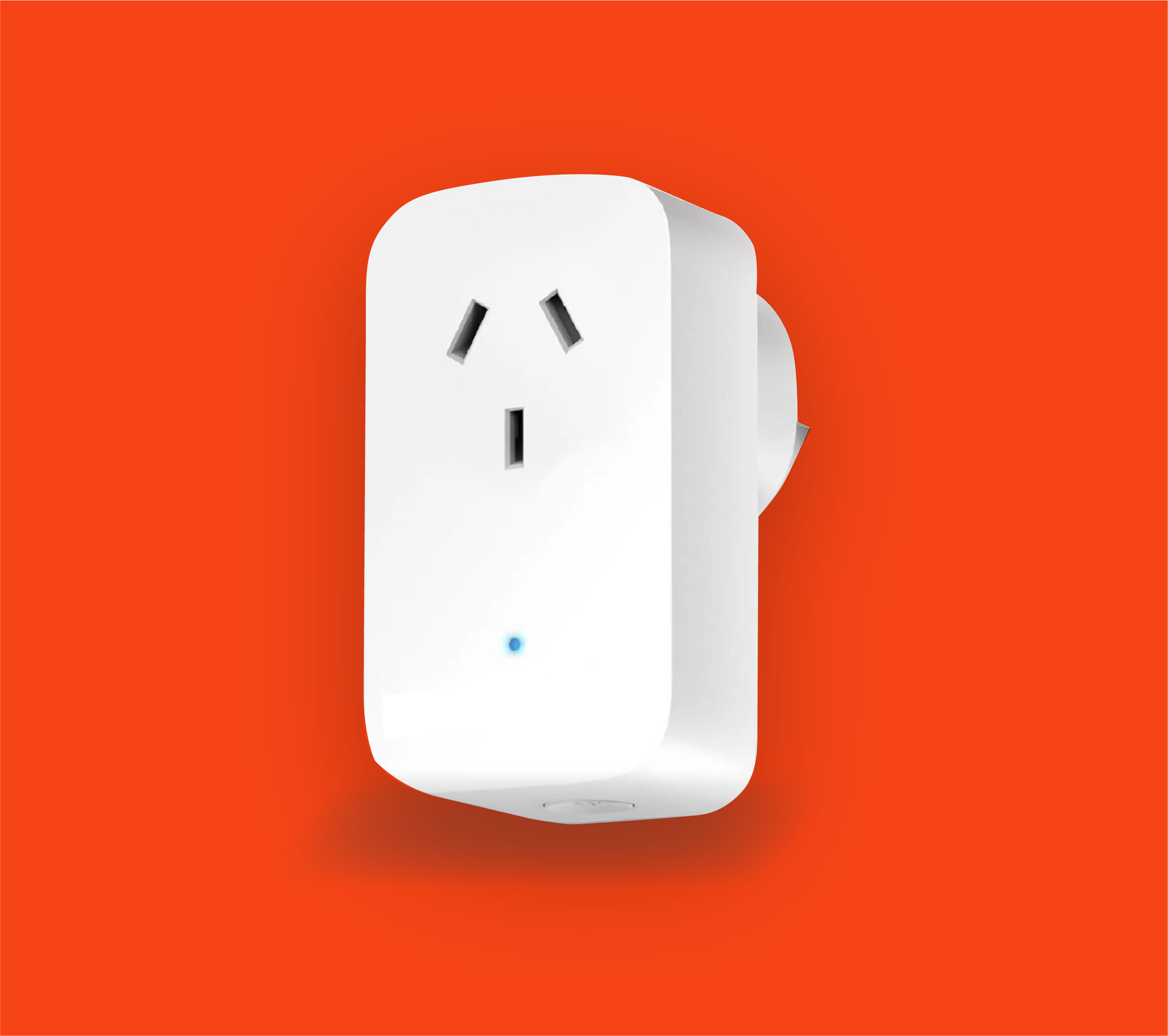 A white Maestro smart plug with a New Zealand power outlet inserted into a wall, set against an orange background.