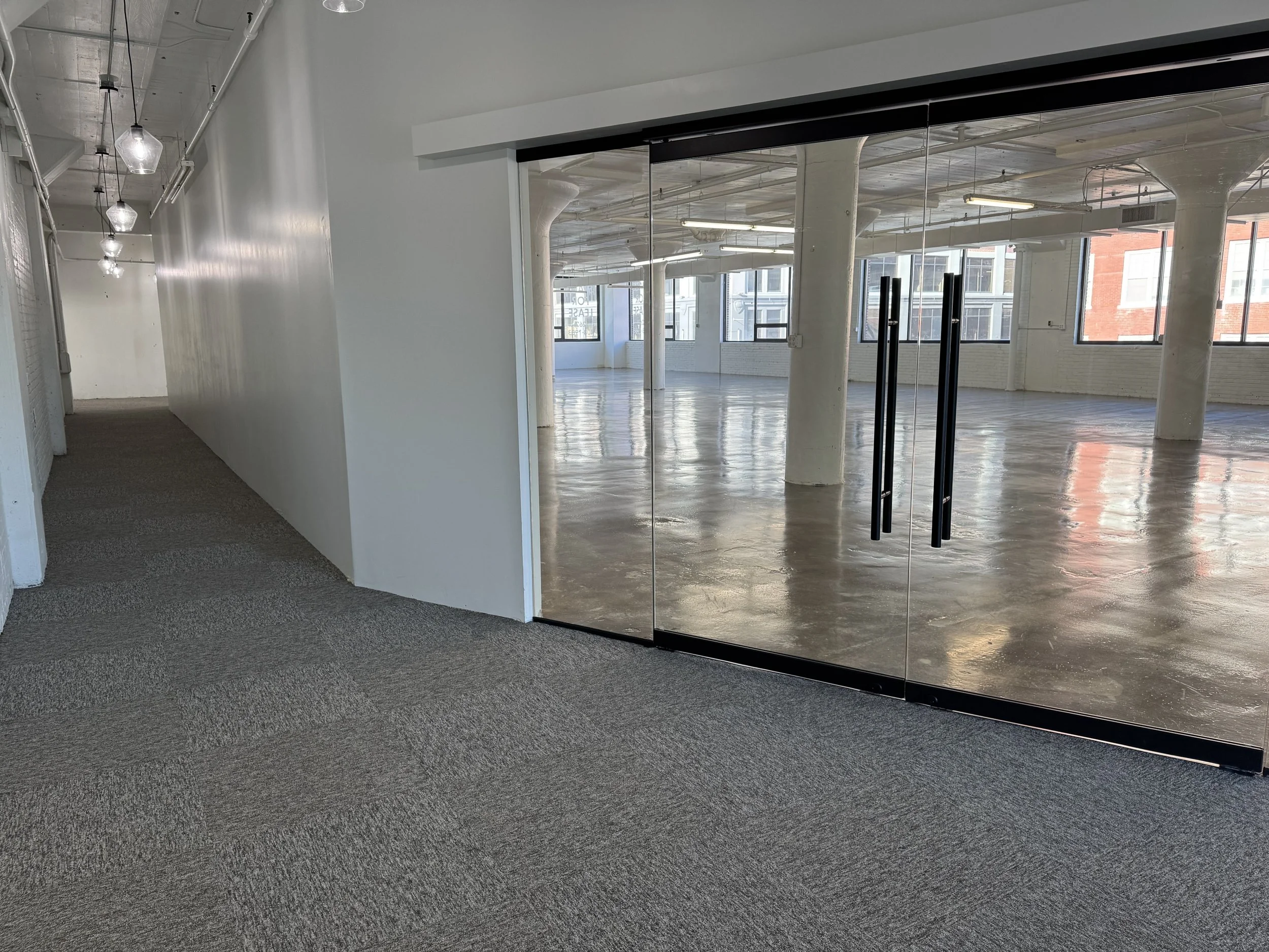 Hallway between the two glass door entrances 