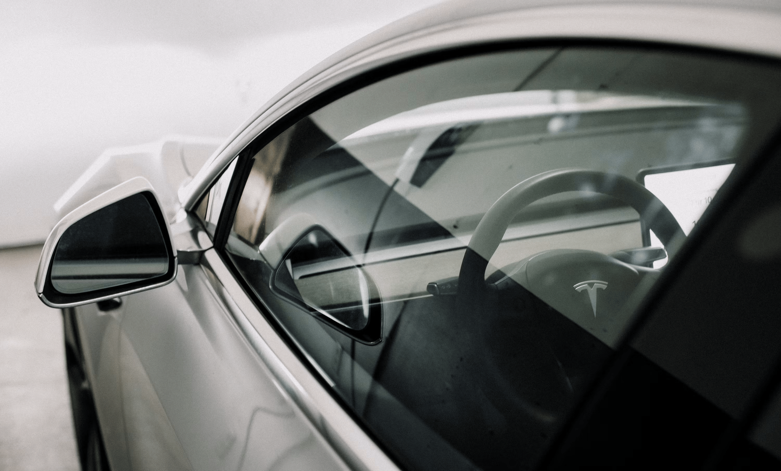 Automotive window tinting in Charlotte, NC featuring a Tesla with professionally tinted windows.