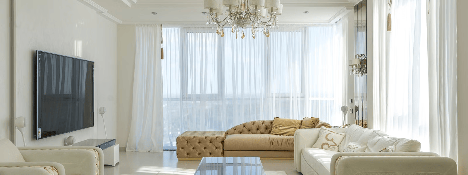 Residential window tinting Charlotte NC, bright living room with large sun facing windows treated with energy-efficient window film for heat and glare control