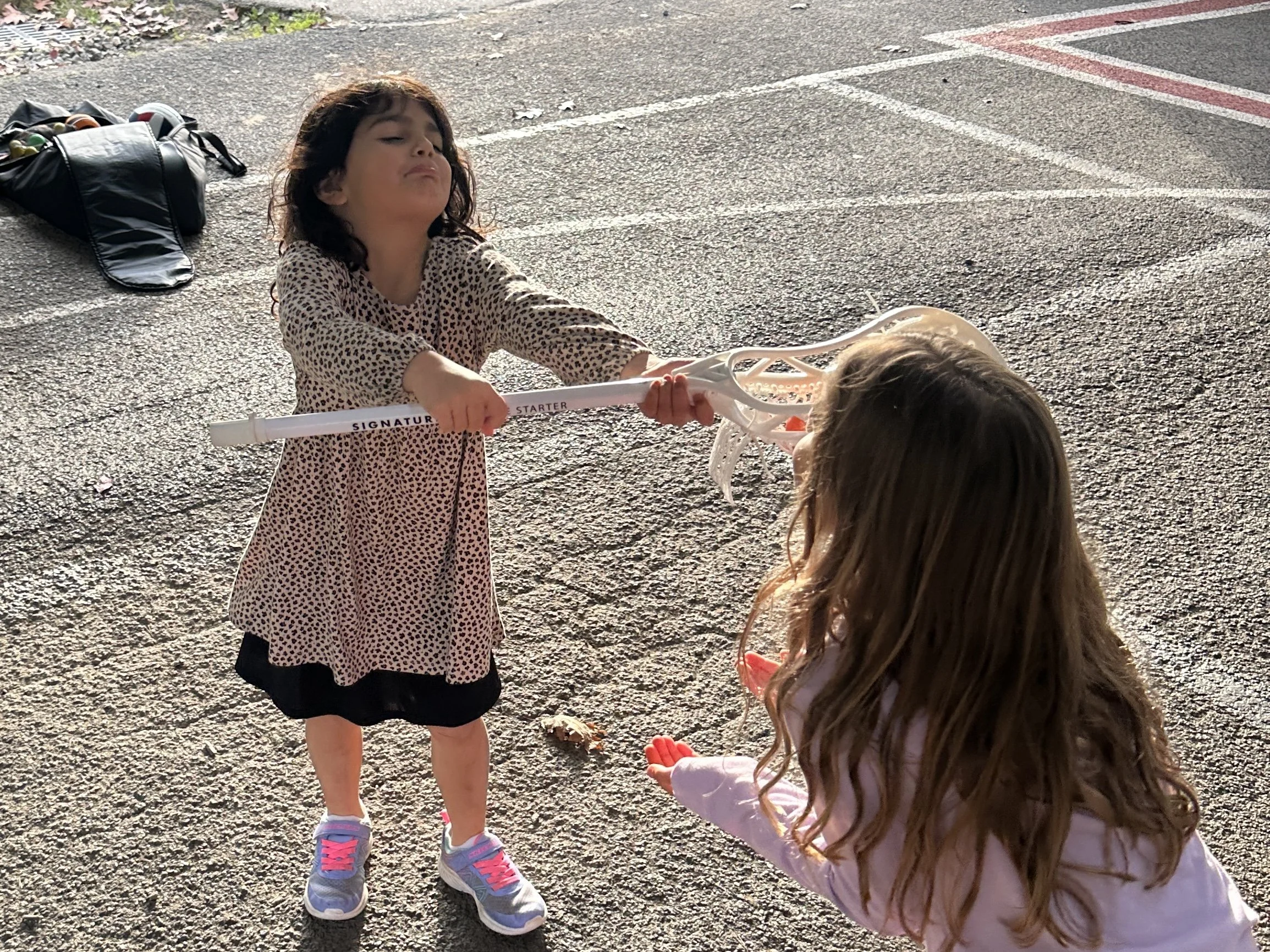 Lacrosse stick handoff.jpg