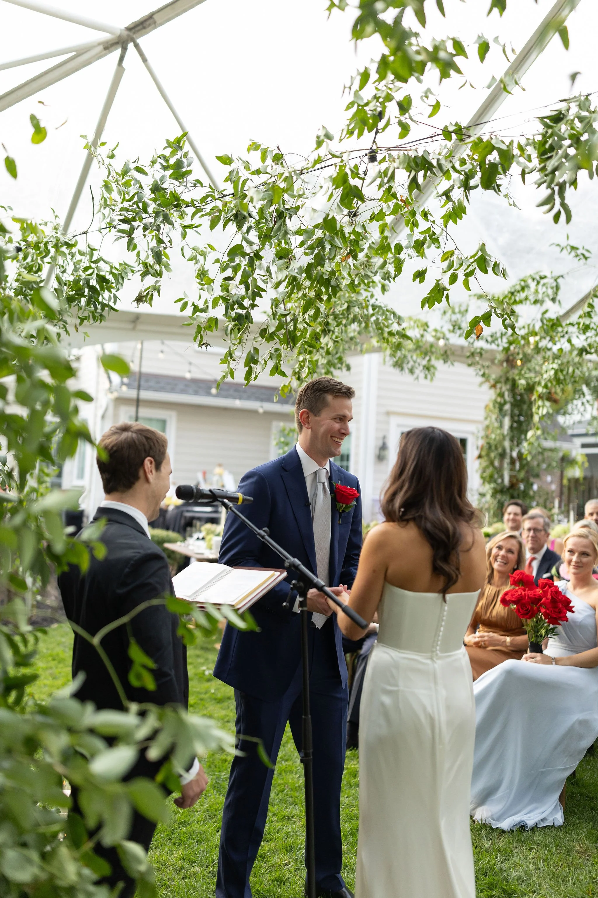 Photo of a couple getting married in their backyard.