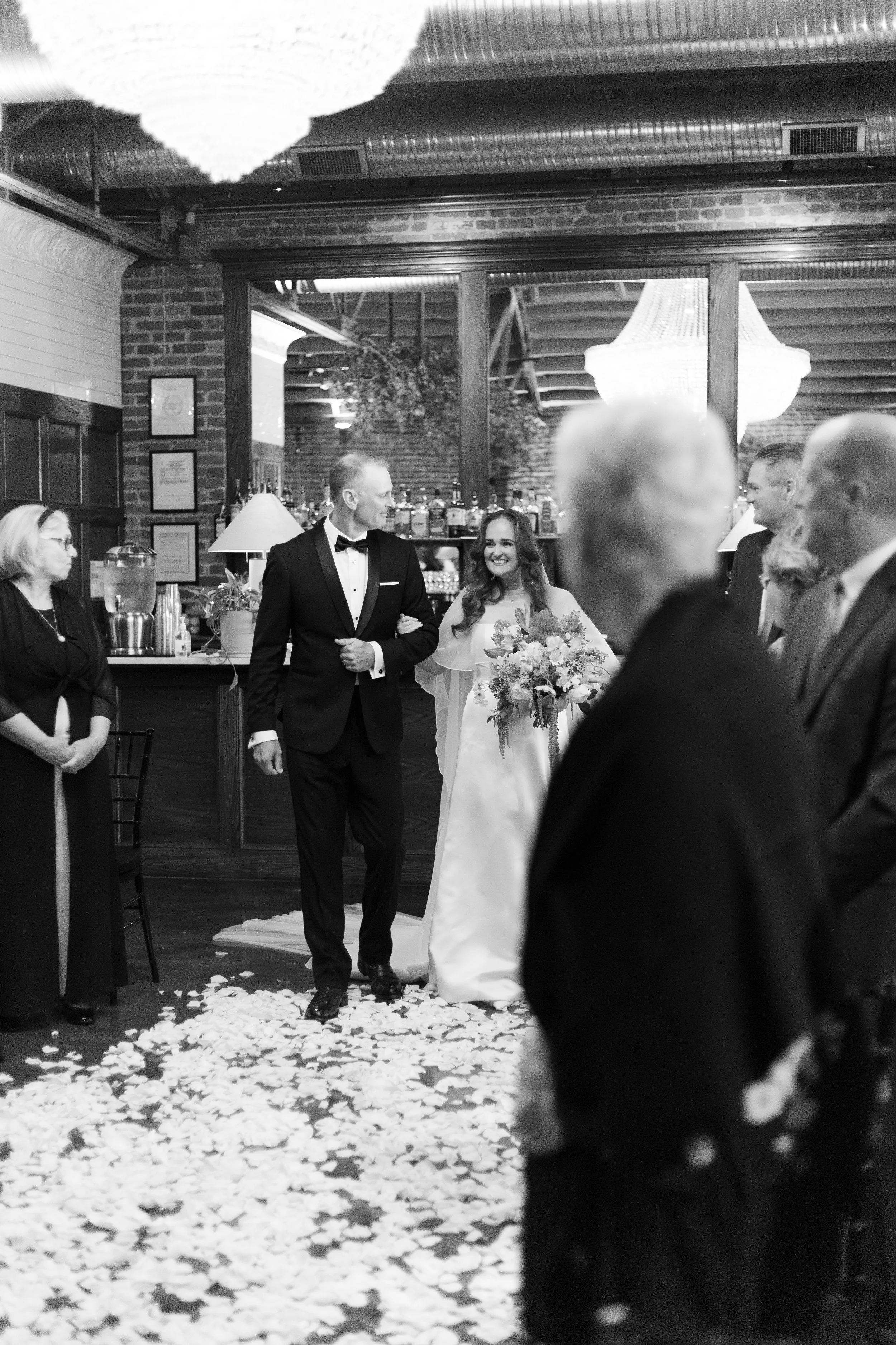 Gracie and her dad as they walk down the aisle during the ceremony.