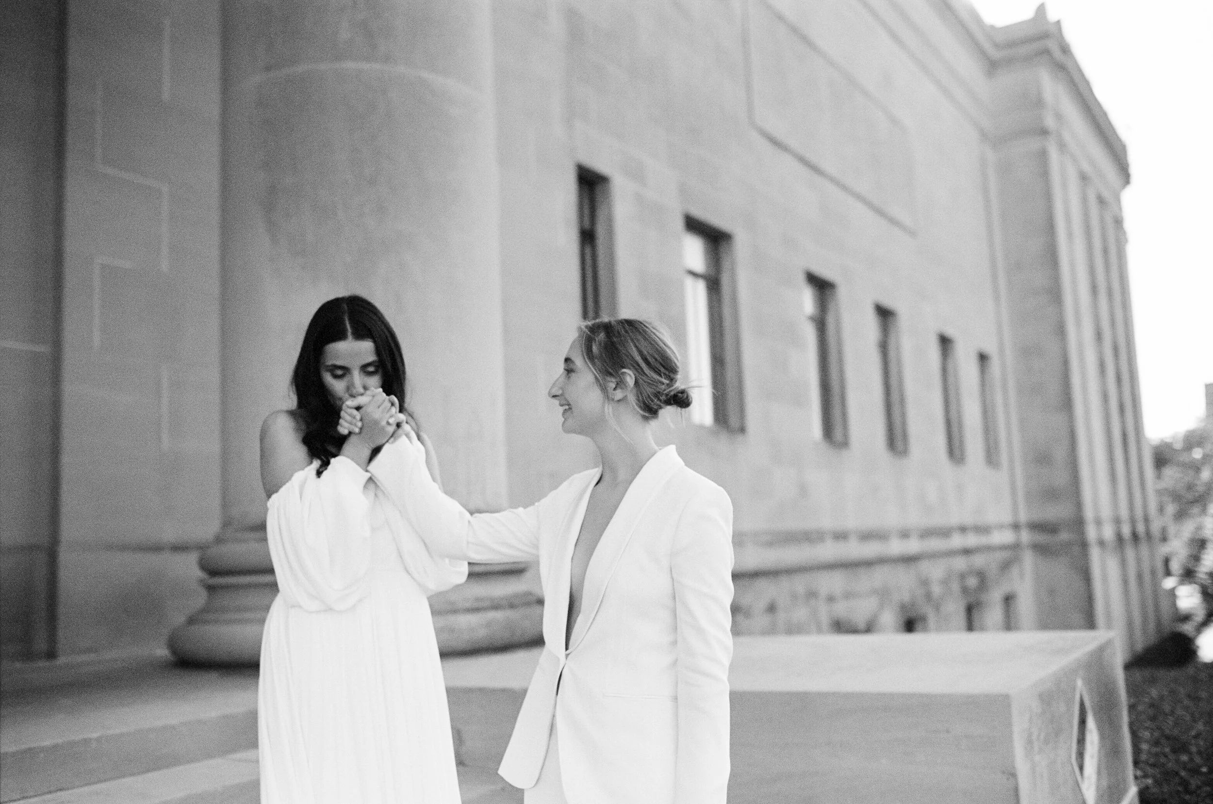 35mm portrait of a bride kissing her wife's hand