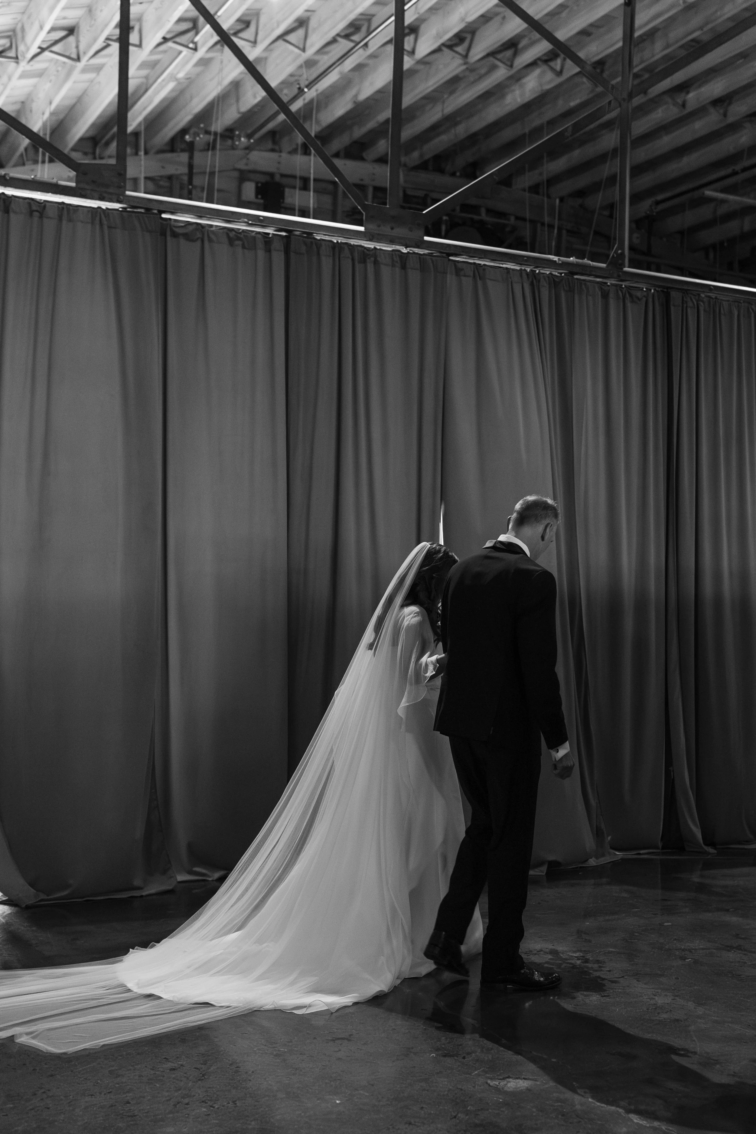 Gracie and her dad walking down the aisle.