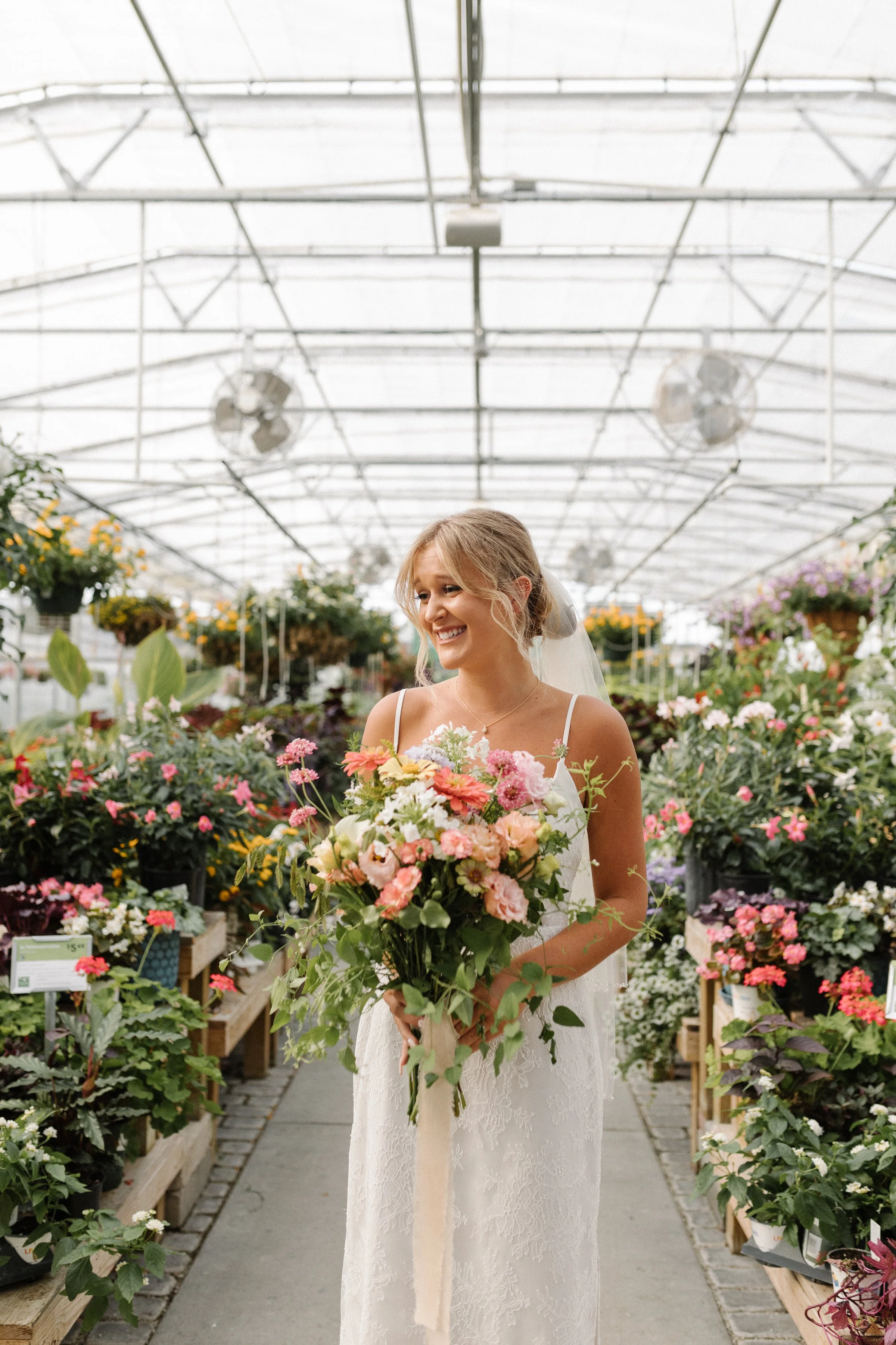 Bridal portrait in the greenhouse at Colonial Gardens.