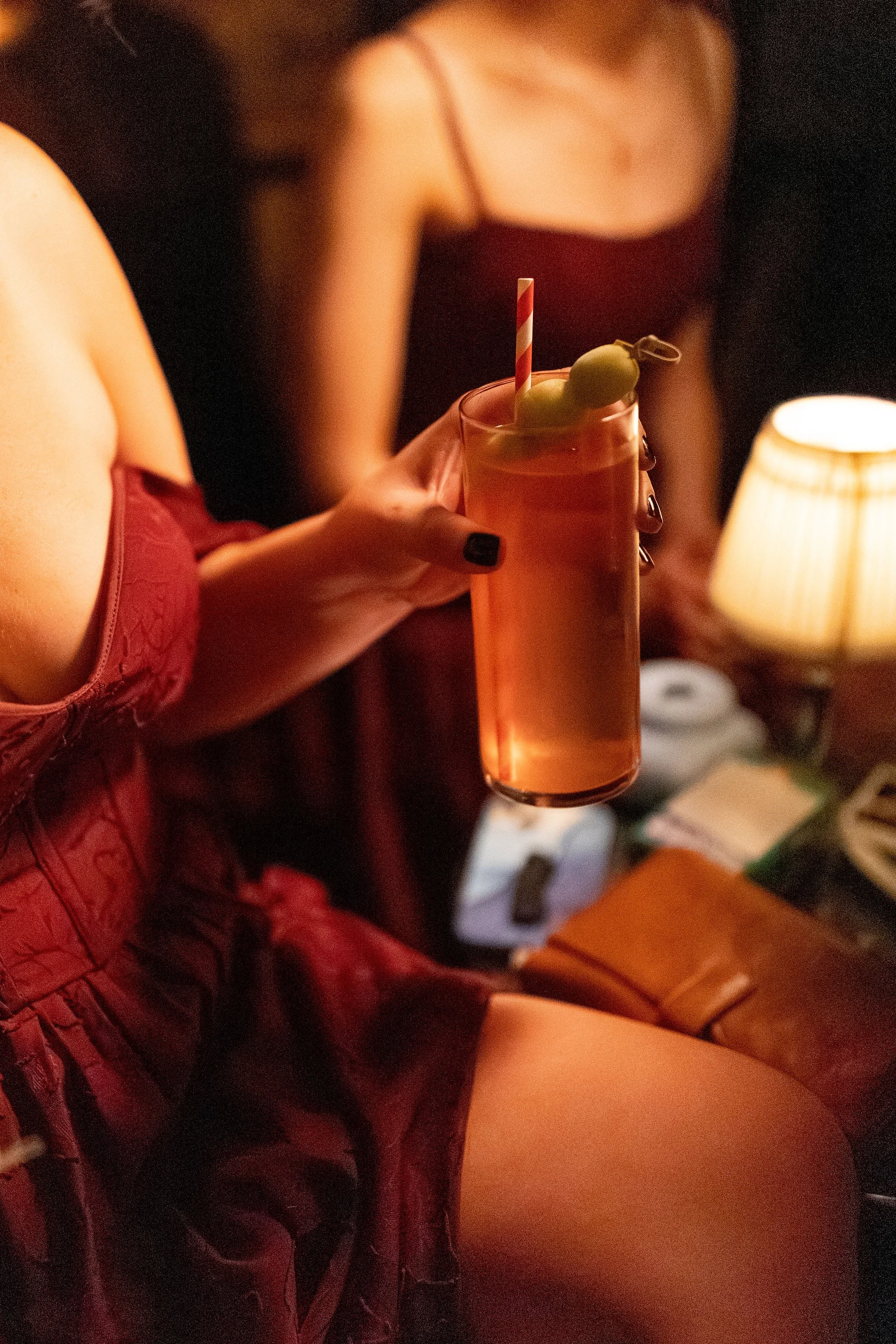 Hand holding a cocktail glass from Le Lounge