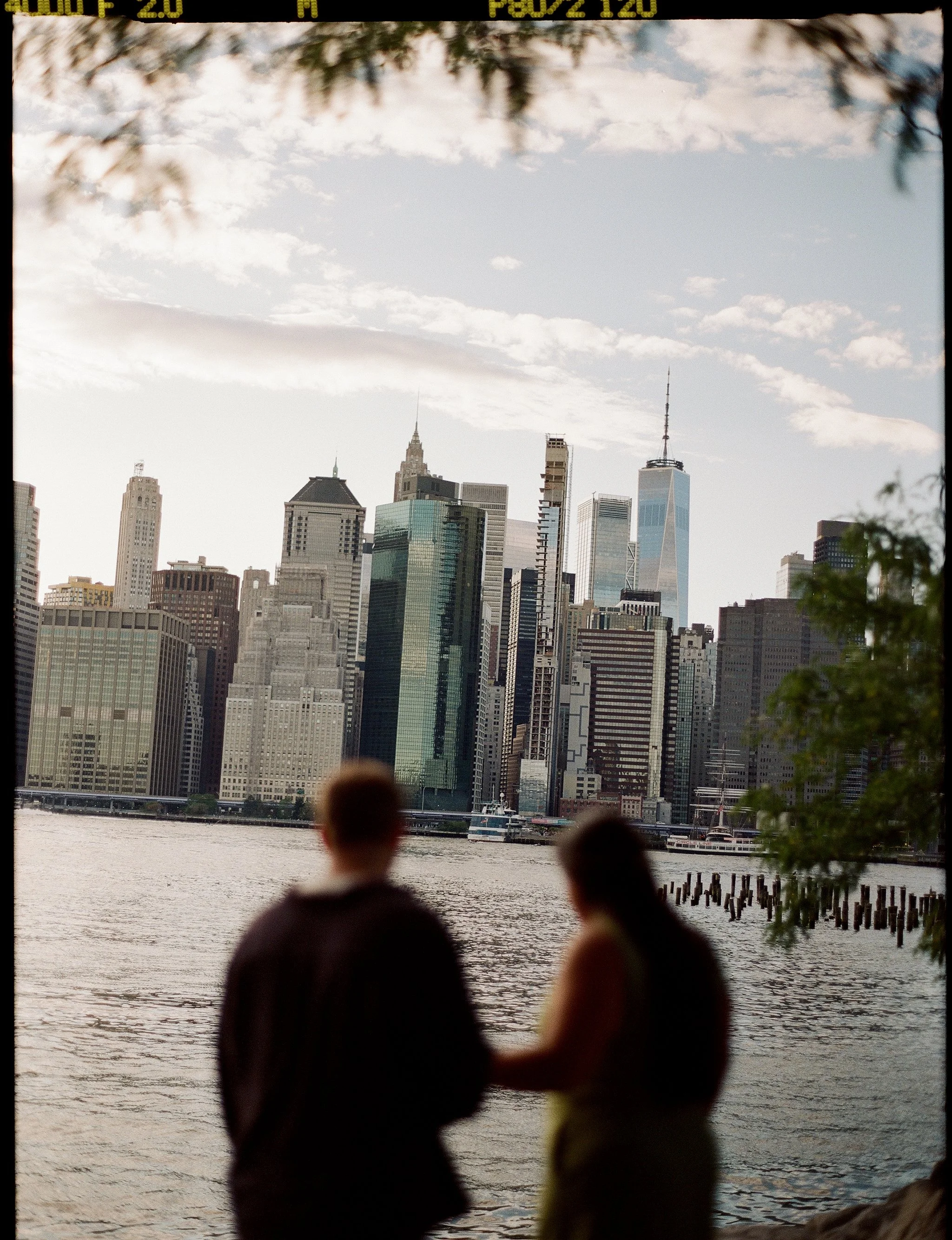 Medium format film photo of a couple at Brooklyn Bridge Park, Brooklyn, New York