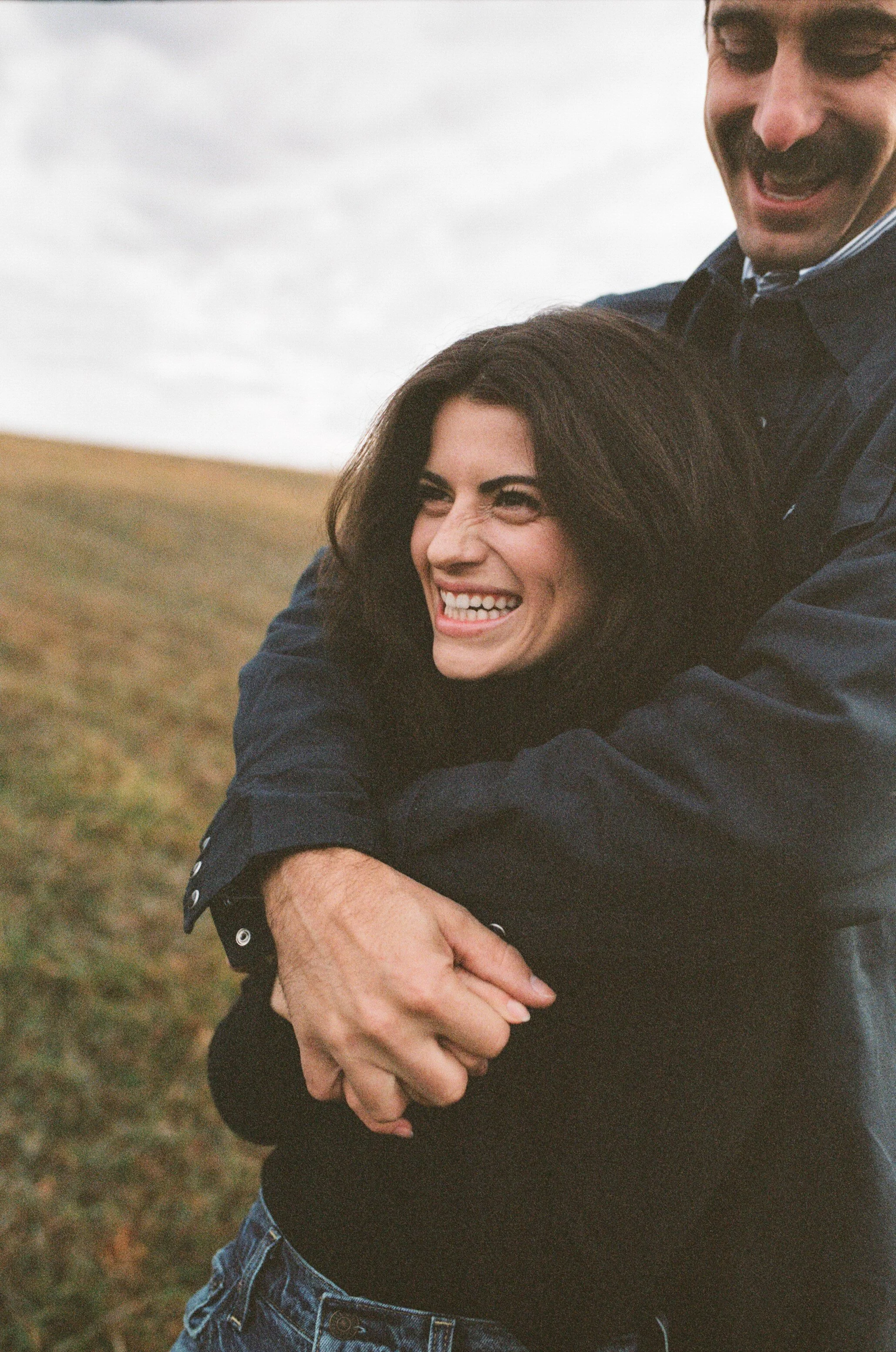 Medium format photograph of a couple in a field