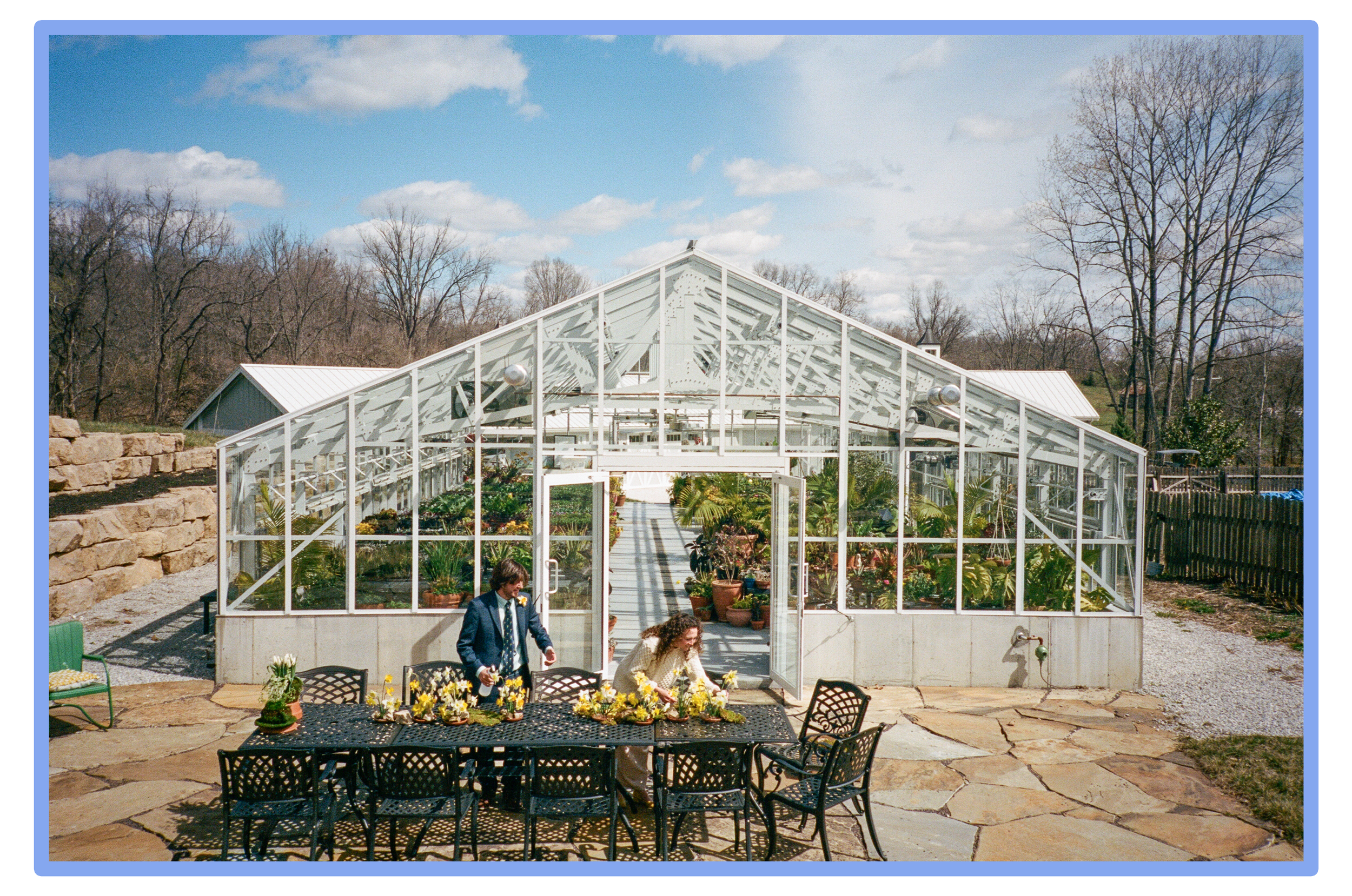 35mm photograph of a couple setting up their reception table at Sunflower Hill Farms in St. Louis