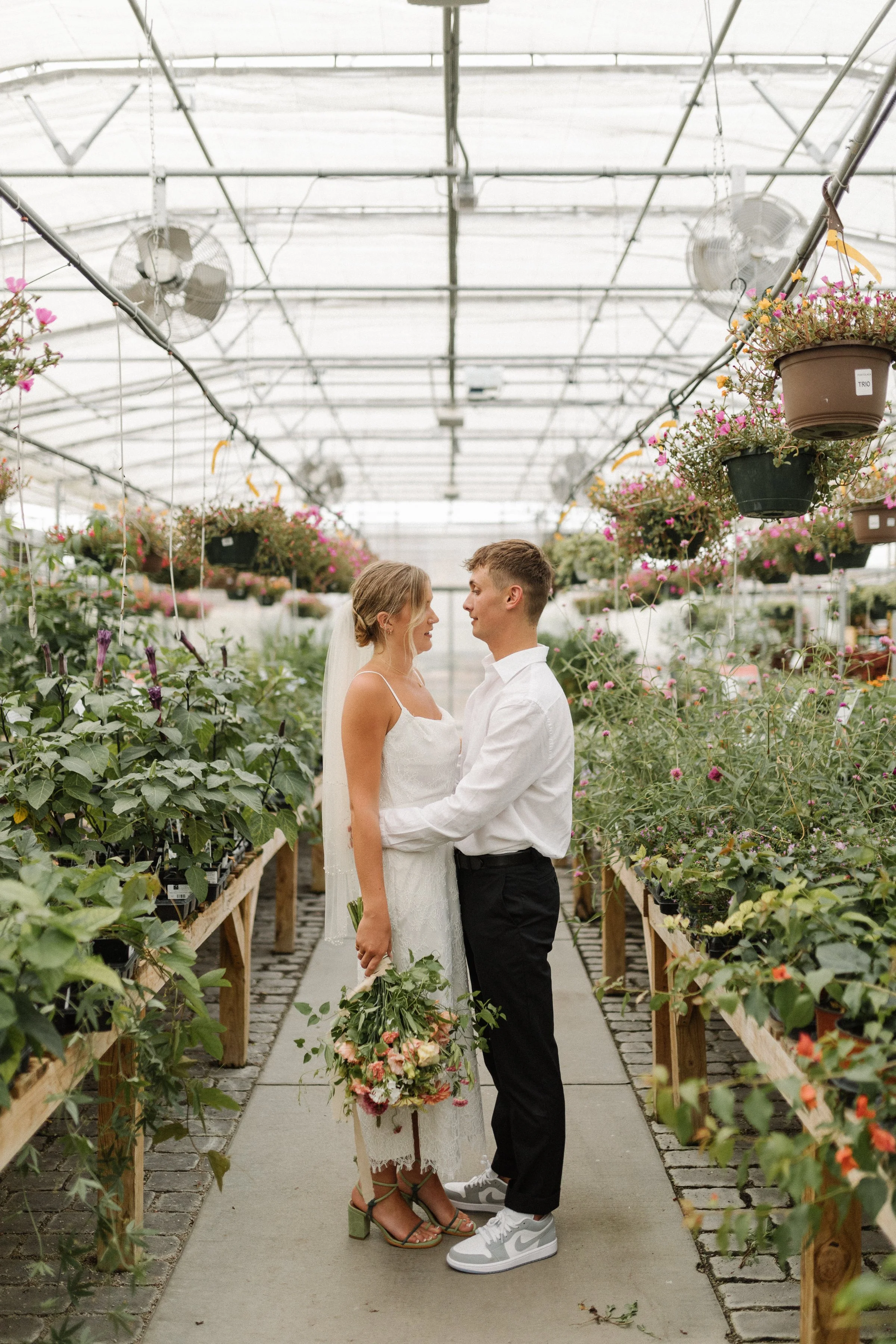 Couple getting married at colonial garden's greenhouse.