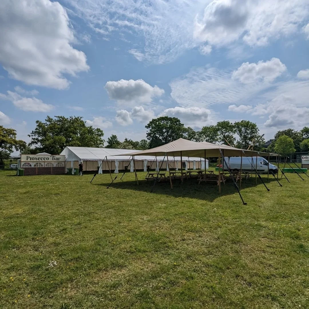 Outdoor event setup with a large white tent - Twelve34 Productions