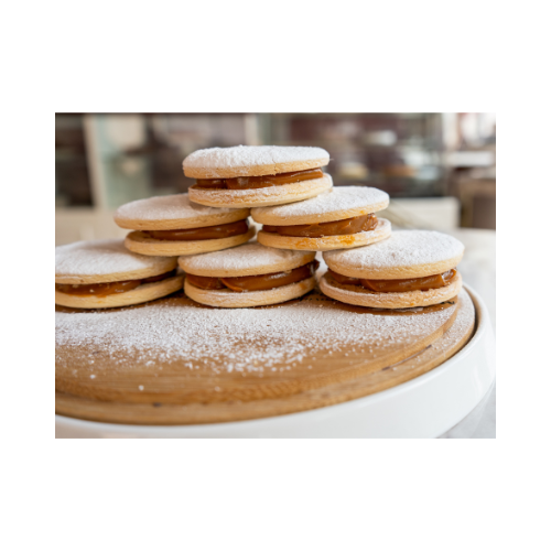 Traditional mini alfajores with soft cookies and dulce de leche center — artisan baked by Dolce Dolcezza in Port St. Lucie, FL.
