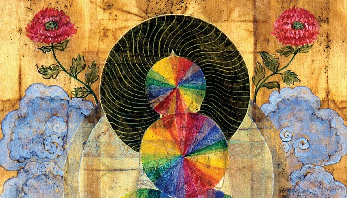 A colorful abstract artwork featuring various circles with rainbow patterns, surrounded by clouds and pink flowers with green stems, on a wooden background.