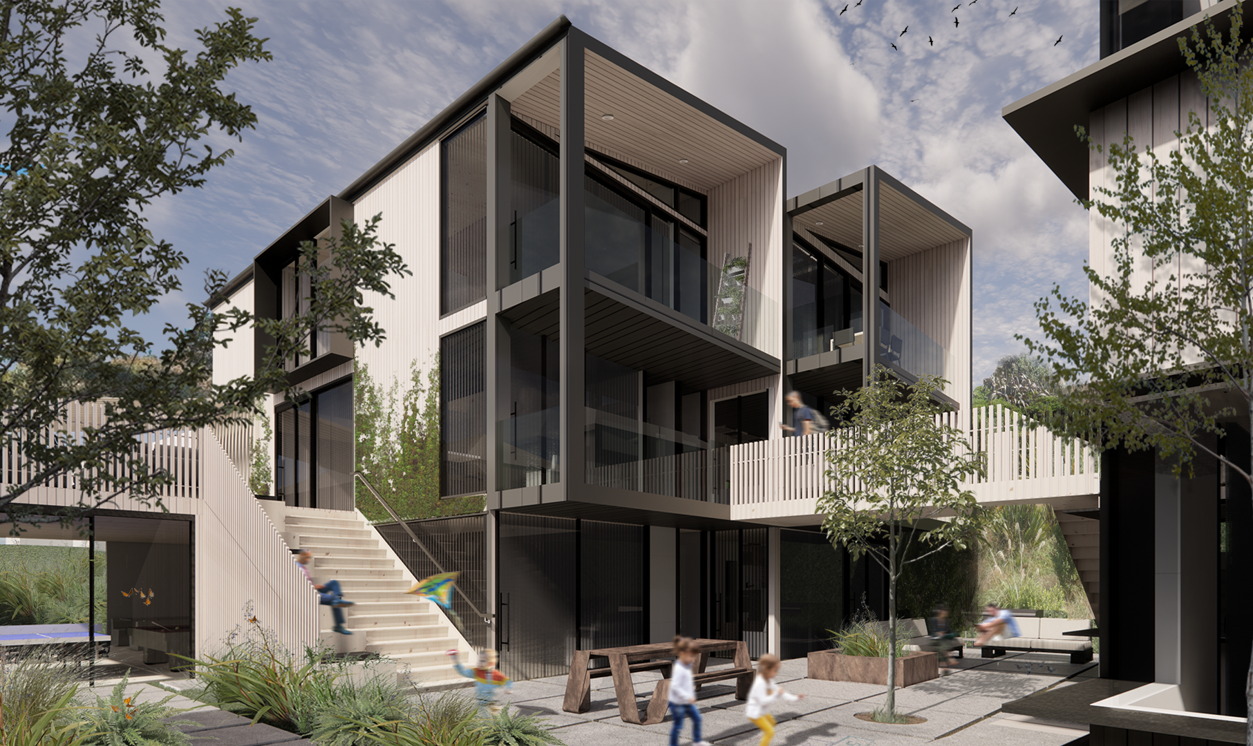 Modern residential building with glass balconies, surrounded by trees and greenery, with children playing in the courtyard.