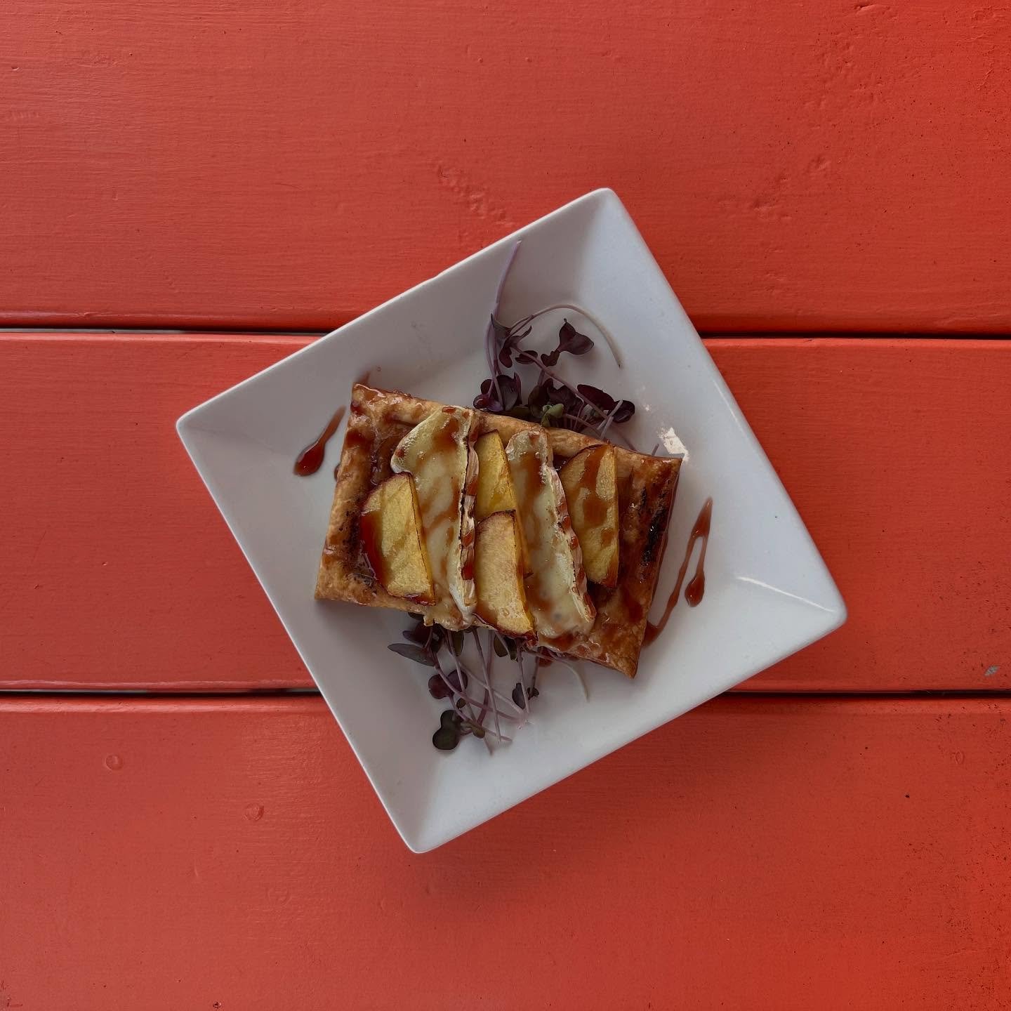 Peach tart- Brie, thyme caramelized onions, red wine gastrique. Come try it for a limited time on our summer menu 🍑