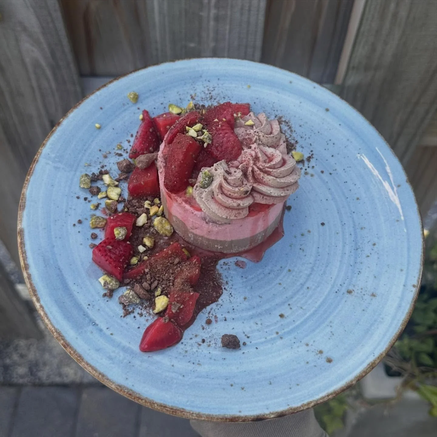 Love season- chocolate and strawberry layered panna cotta, macerated strawberries, chocolate whip, chocolate soil, and candied pistachios. 💕