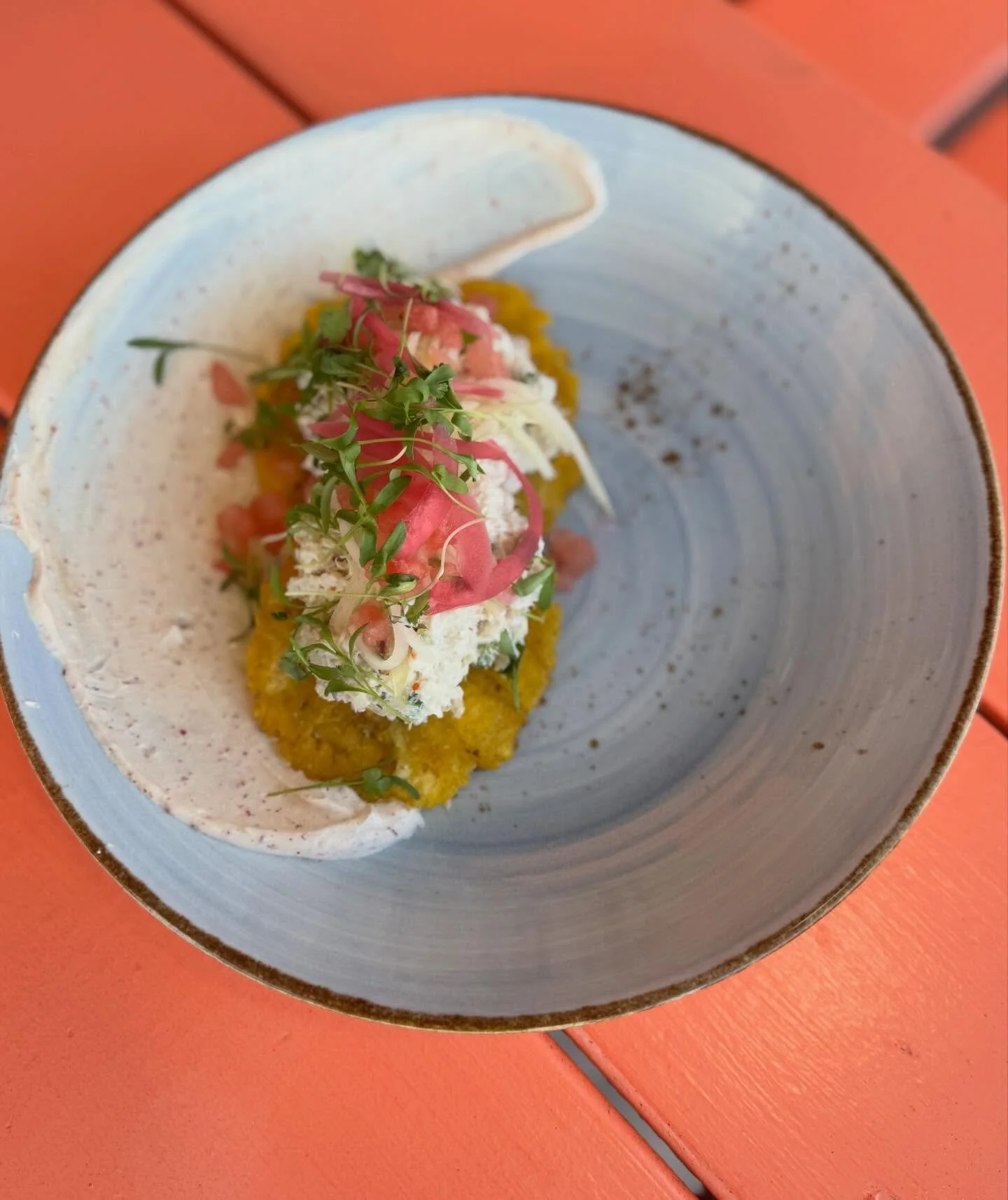 New crab feature- tajin crema, tostones, crab salad. Topped with pickled watermelon rind, green papaya, and red onion. Finished with fresh watermelon and micro cilantro. 🌿