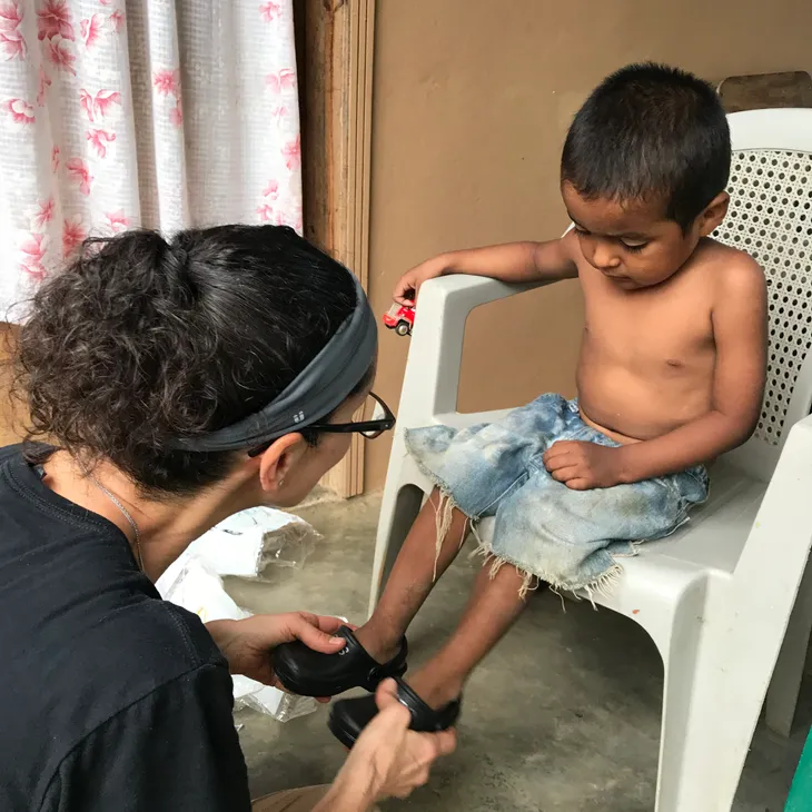 Small child getting new shoes