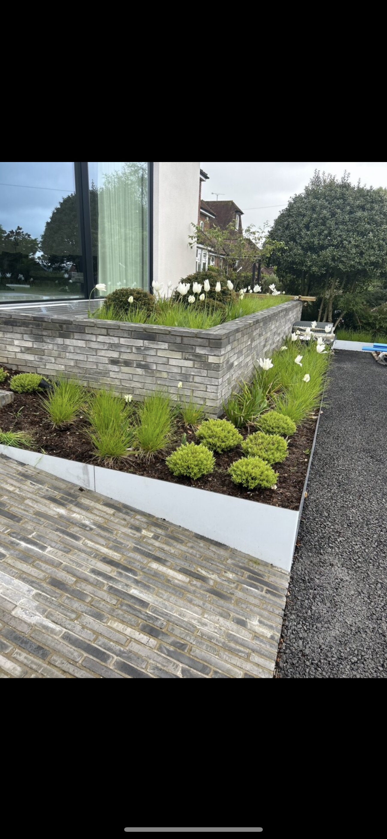 Overview of natural front garden in Wheathampstead with lush perennials and entrance pathway