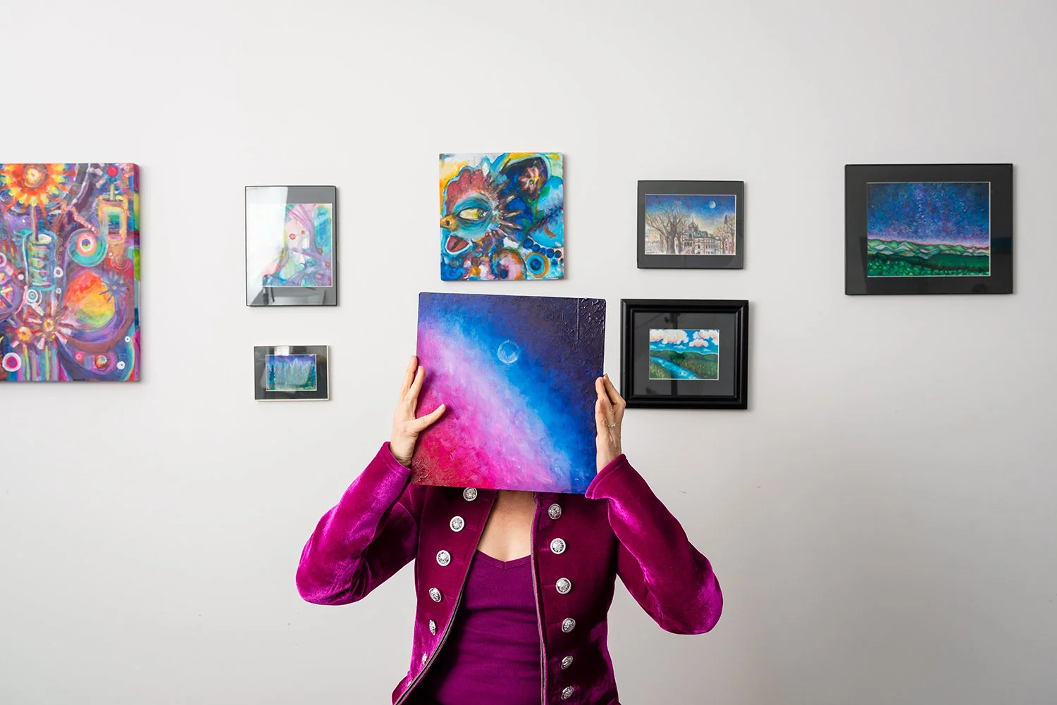 Artist holding a painting -- Brand Photography session with Nikki Gardner Studio