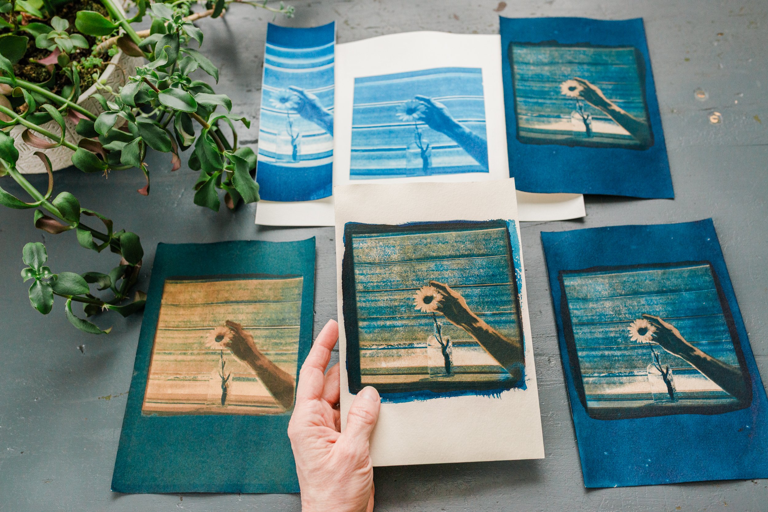 hand holding original handmade cyanotype art print