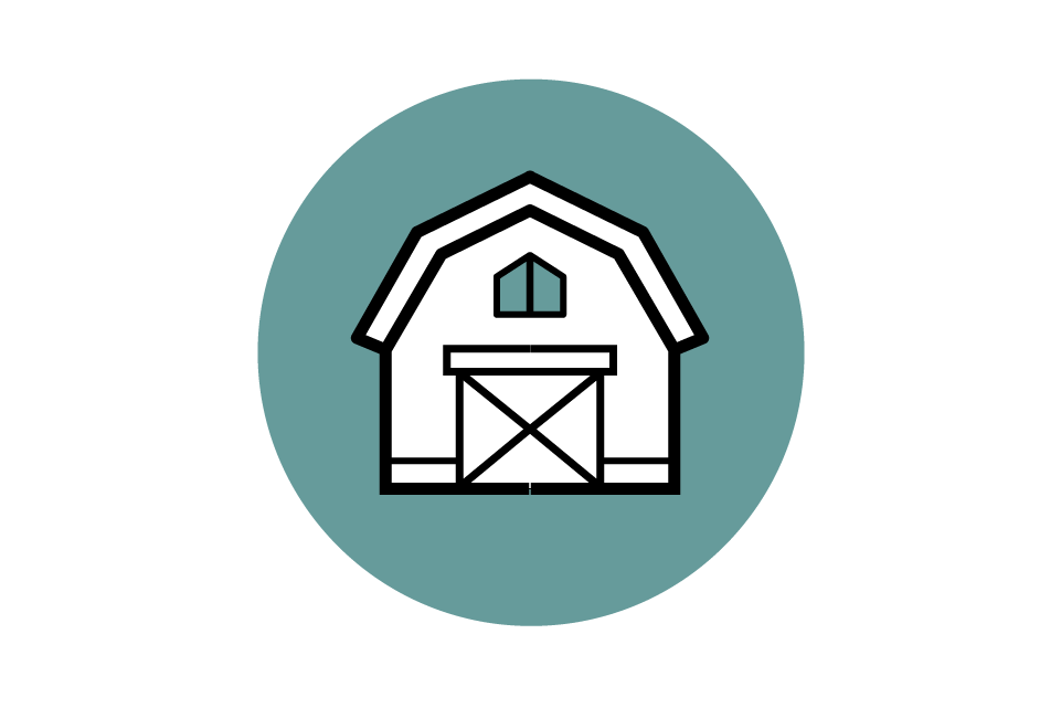 Line drawing of a barn inside a teal circle.
