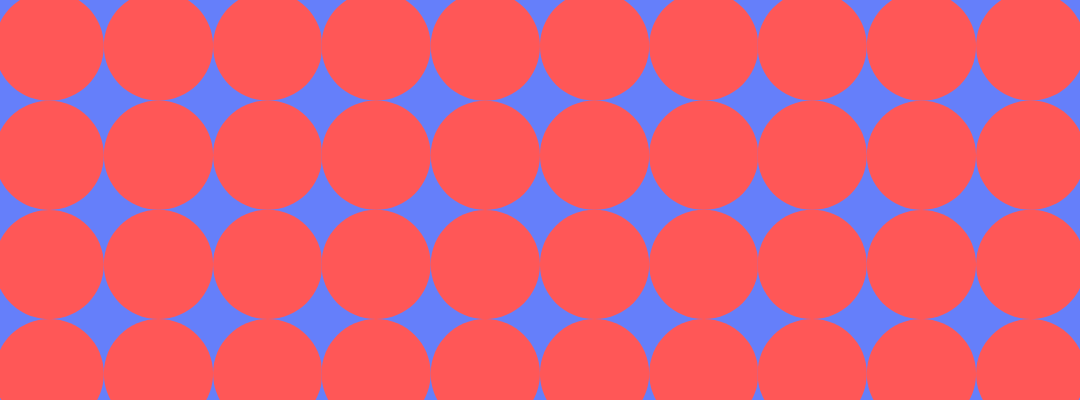 A pattern of red circles arranged in a grid with a blue background.