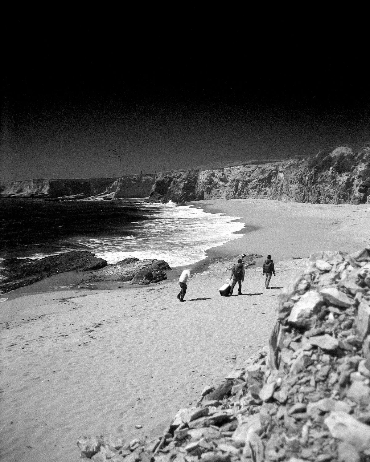 Three fishermen in Santa Cruz. Watched them traverse slippery rocks as the tide rose closer to them, the three offered me a nod as they passed