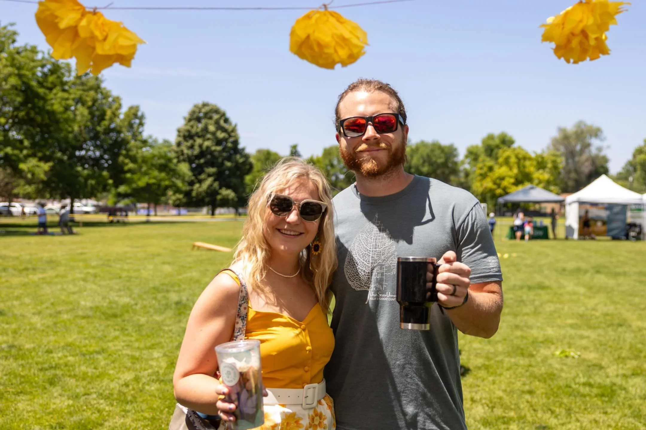 Couple enjoying beverages at Dandelion Festival