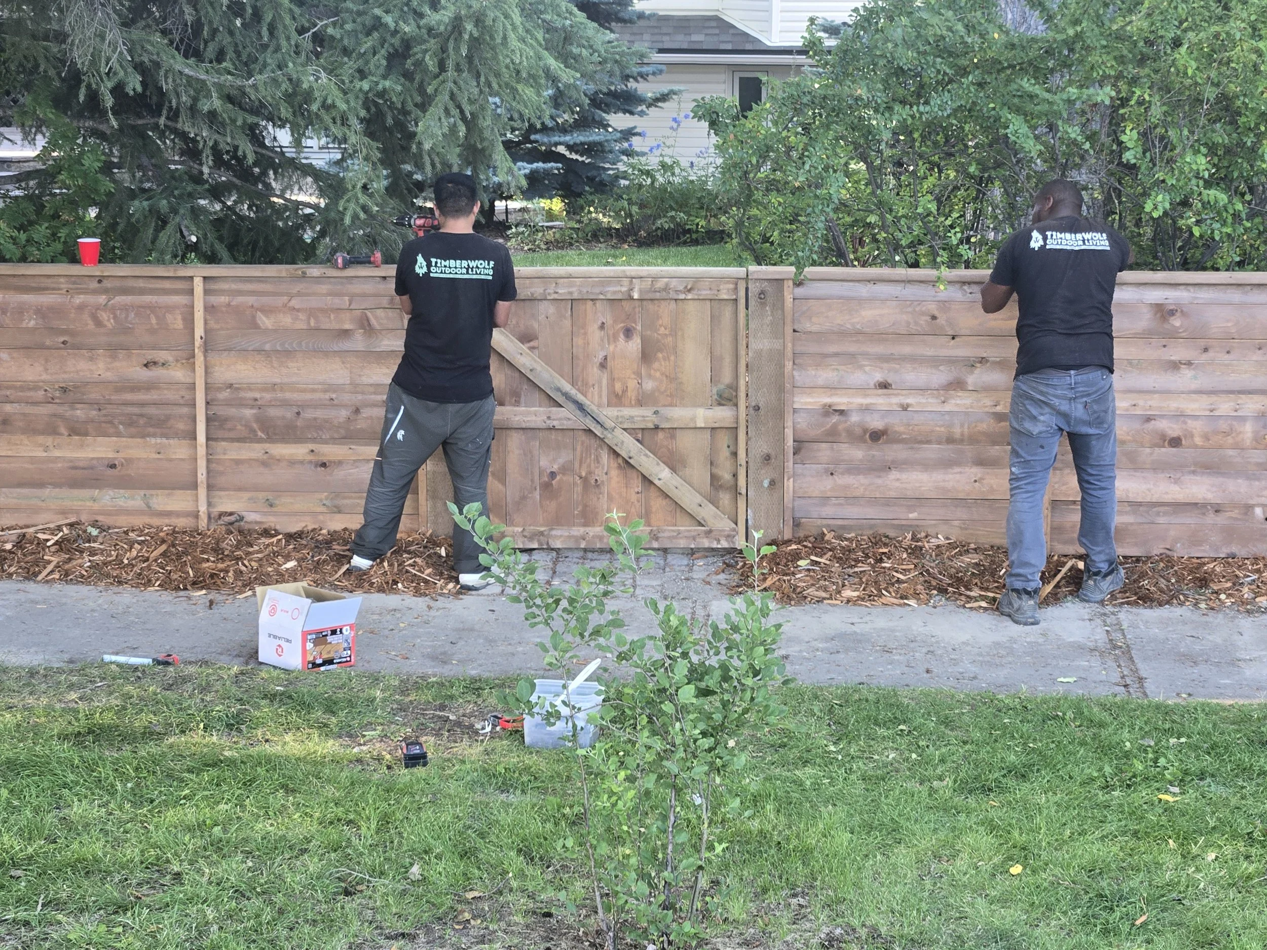 Employees Building a Fence