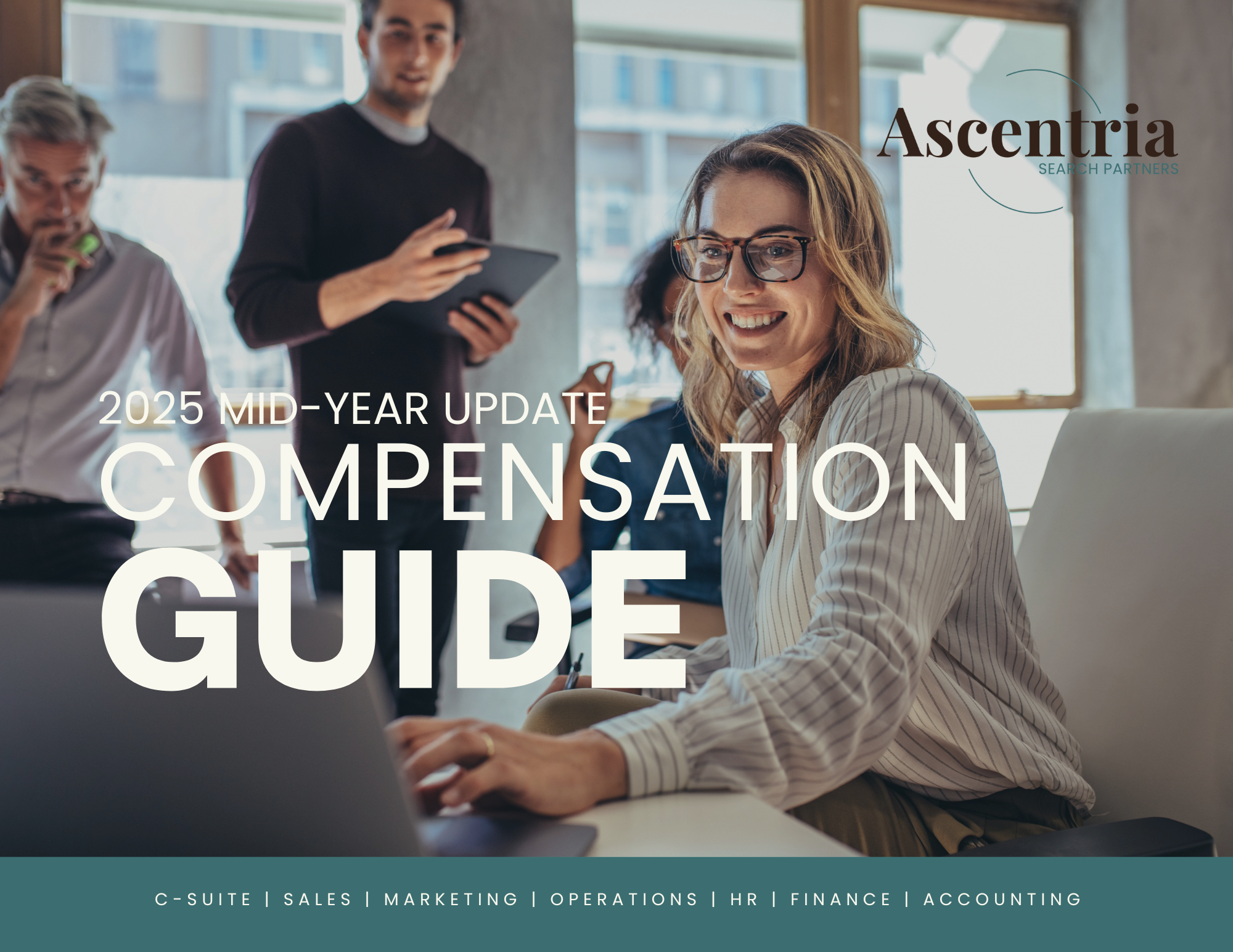 Business meeting with smiling woman working on laptop and colleagues discussing in the background, in an office setting.