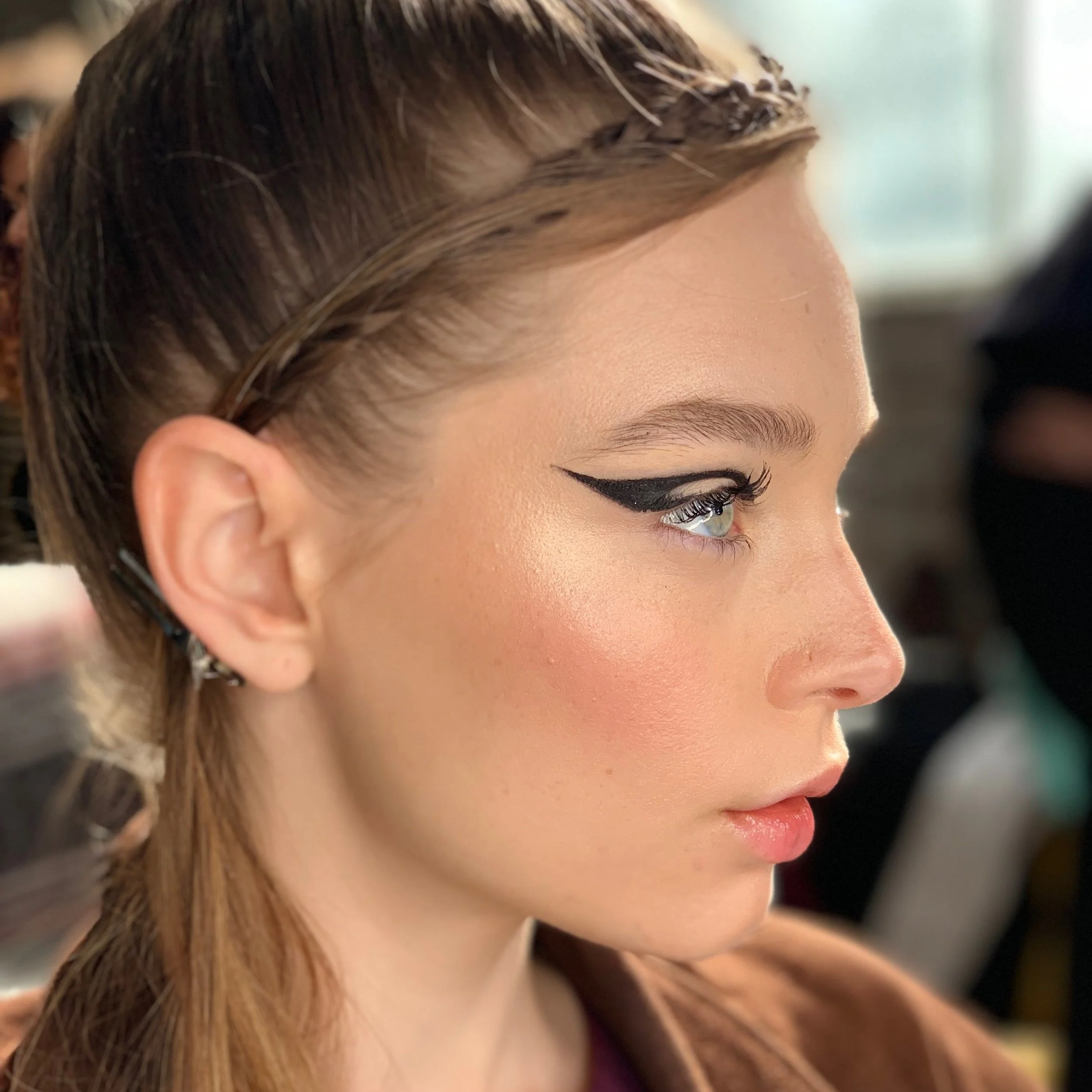 Editorial eye makeup with sculpted waves and braided hair by Sydney hair and makeup artist Nikki Mahera