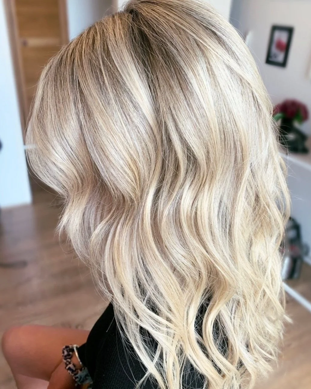 Dimensional blonde hair colour with soft waves by Sydney hairdresser Nikki Mahera