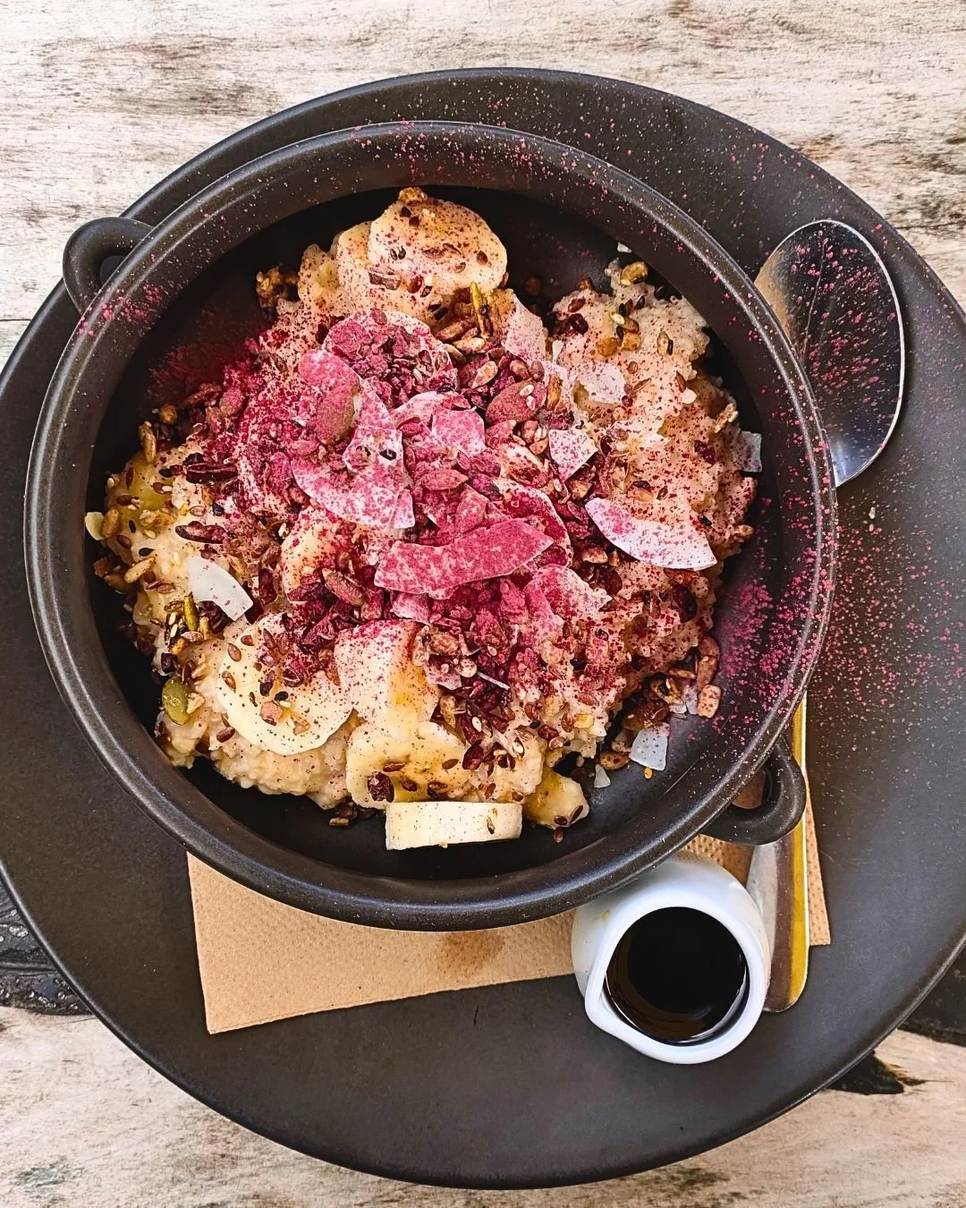 Before the week gets loud, start quietly with this.
Our porridge is back. Warm, deeply nourishing, the kind of bowl that slows you down in the best way. Oats, banana, coconut chips, maple roasted seeds, cacao nibs, maple syrup and hibiscus dust.
You'