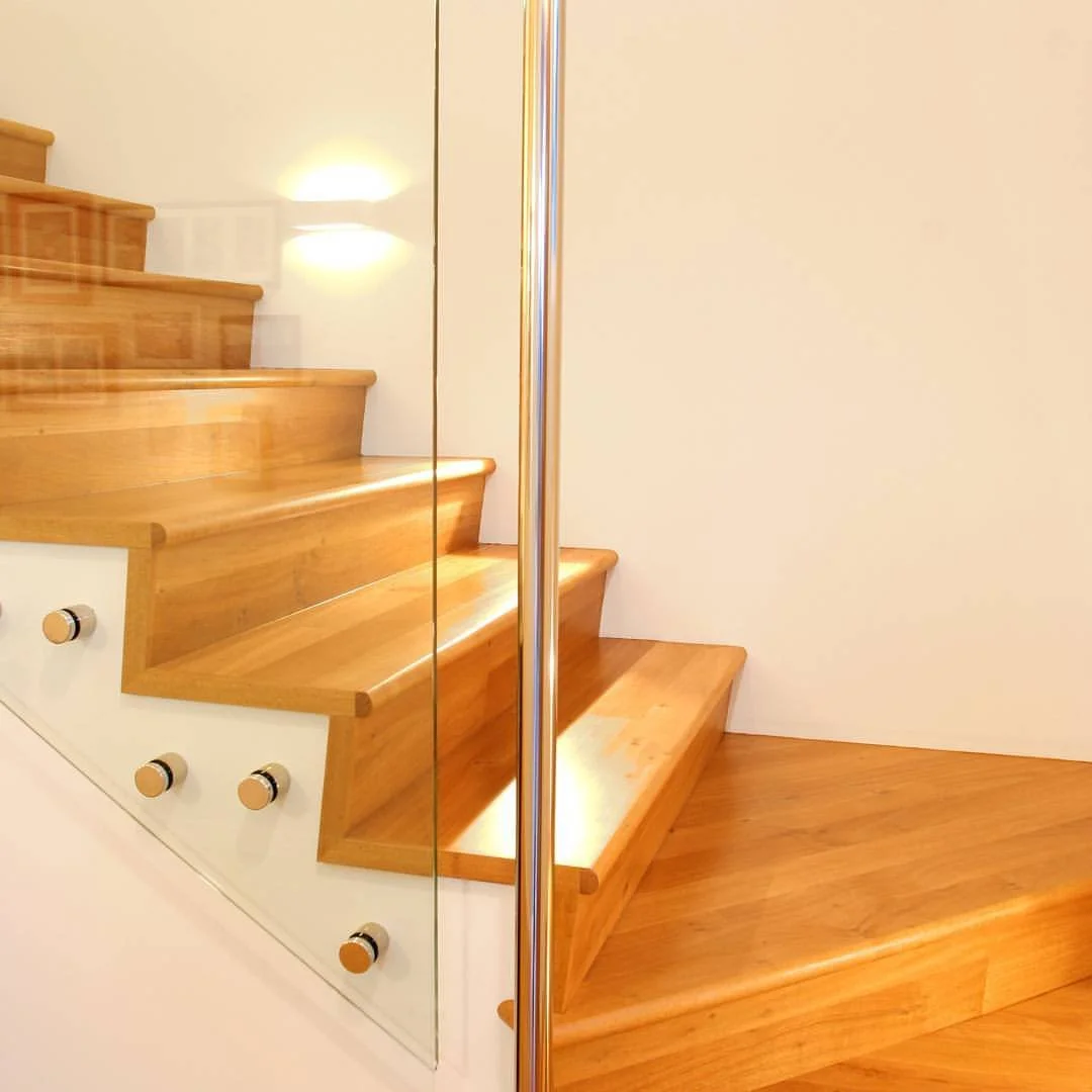 Grand Blackbutt staircase by Dave &amp; Lee &mdash; a standout feature blending craftsmanship, detail and timeless design.

Frameless glass balustrade and recessed LED lighting bring a modern touch to a classic build.

#PhilKelleherHomes
#Craftsmansh