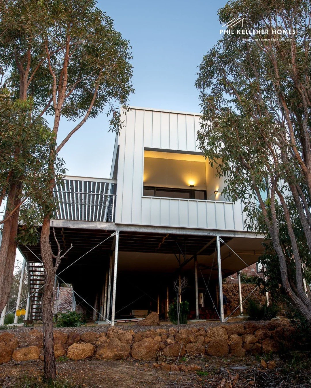 Shaped by the land, not forced onto it.

This Eagle Bay home follows the site&rsquo;s natural contours, with a curved form that responds to landscape, light and coastal conditions.

Inside, timber, brick and expansive glazing create warmth and connec