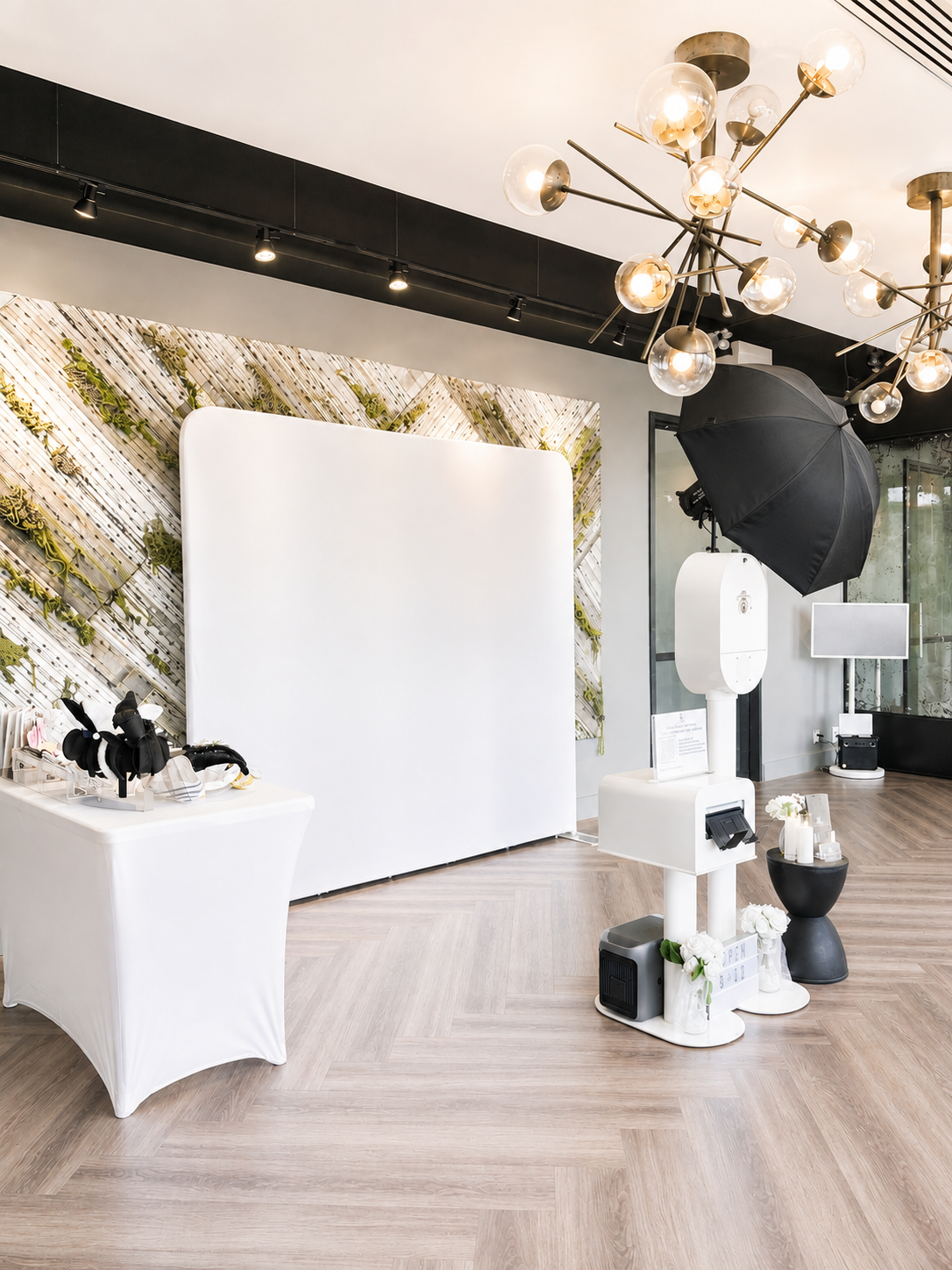 Photography studio setup with professional lighting, a backdrop, and photography equipment.