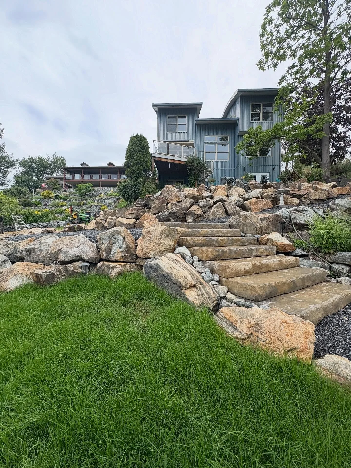 As our season comes to a close, we&rsquo;ve been looking back on some of the projects we were proud to complete this year. This one in Lake Country was one of our largest. 

The backyard received a full transformation: boulder walls, concrete stairca