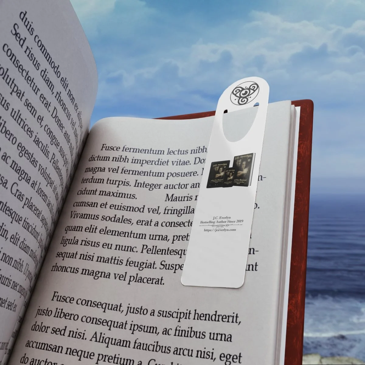 Open book with placeholder text on pages, and a white bookmark with an ornate black logo, placed against a sky and ocean background.