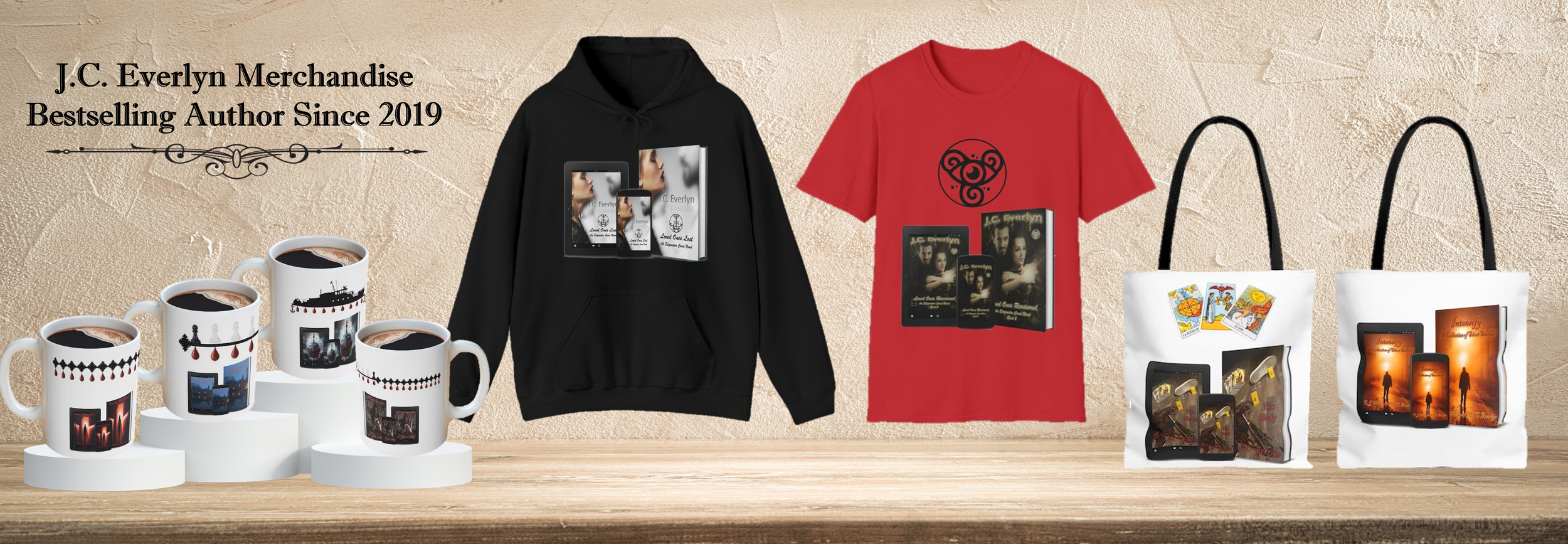 Display of merchandise including four coffee mugs with cityscape designs, two sweatshirts with book covers, and two tote bags with book covers and tarot cards, all arranged on a wooden surface against a beige textured background.