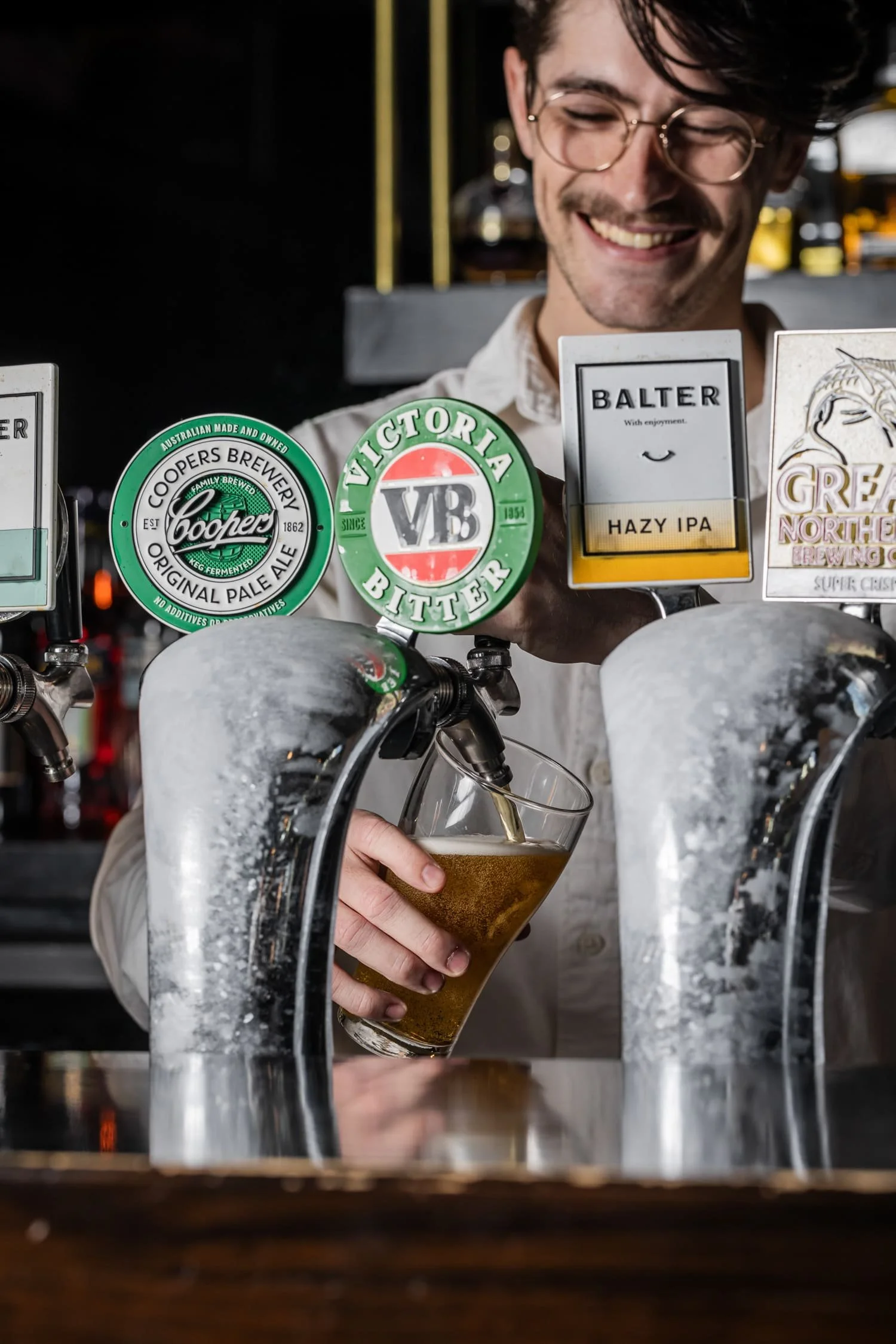 St Leonards Tav bartender pouring beer