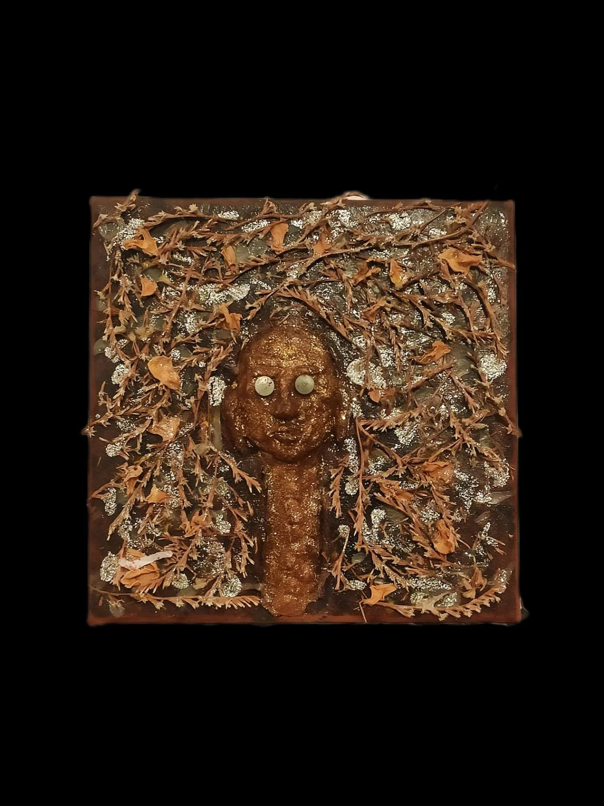 Abstract artwork with a face made of organic materials