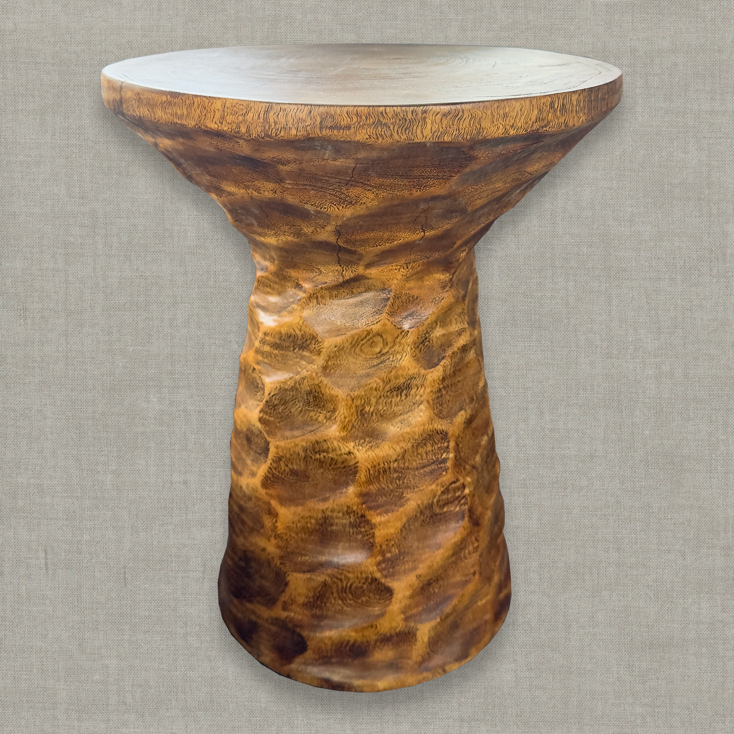 Hand carved solid mango wood sculptural pedestal table in natural erosion semi glossy finish for a modern California living room