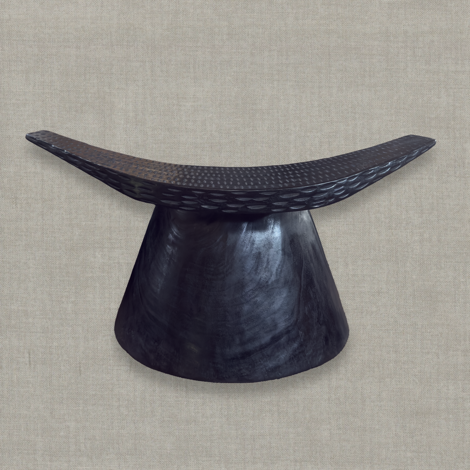 Sculptural mango wood bench with curved seat and carved details in matte black finish styled for modern interior in California