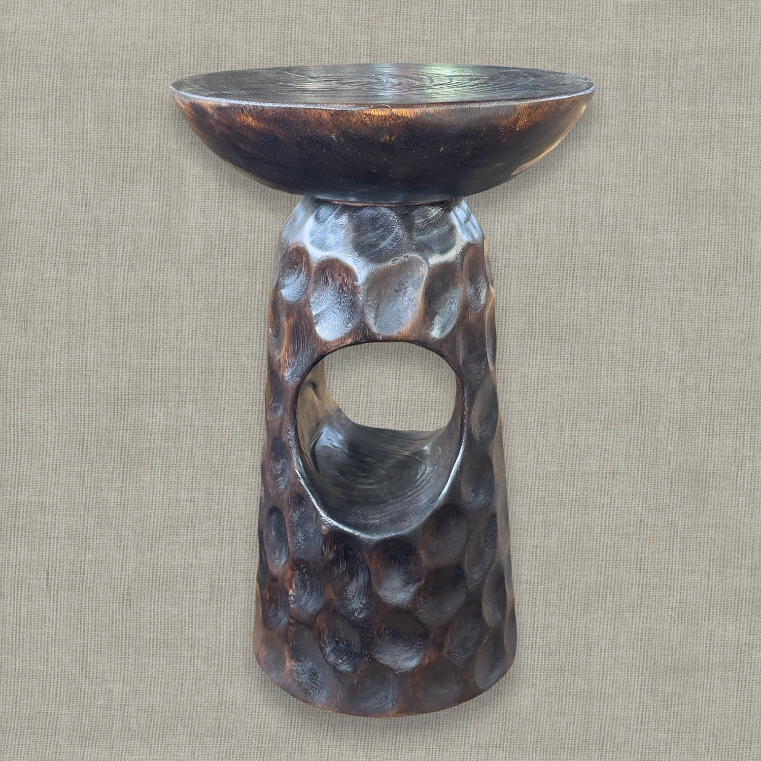 Hand carved solid mango wood sculptural pedestal table in glossy dark brown finish for a modern California living room