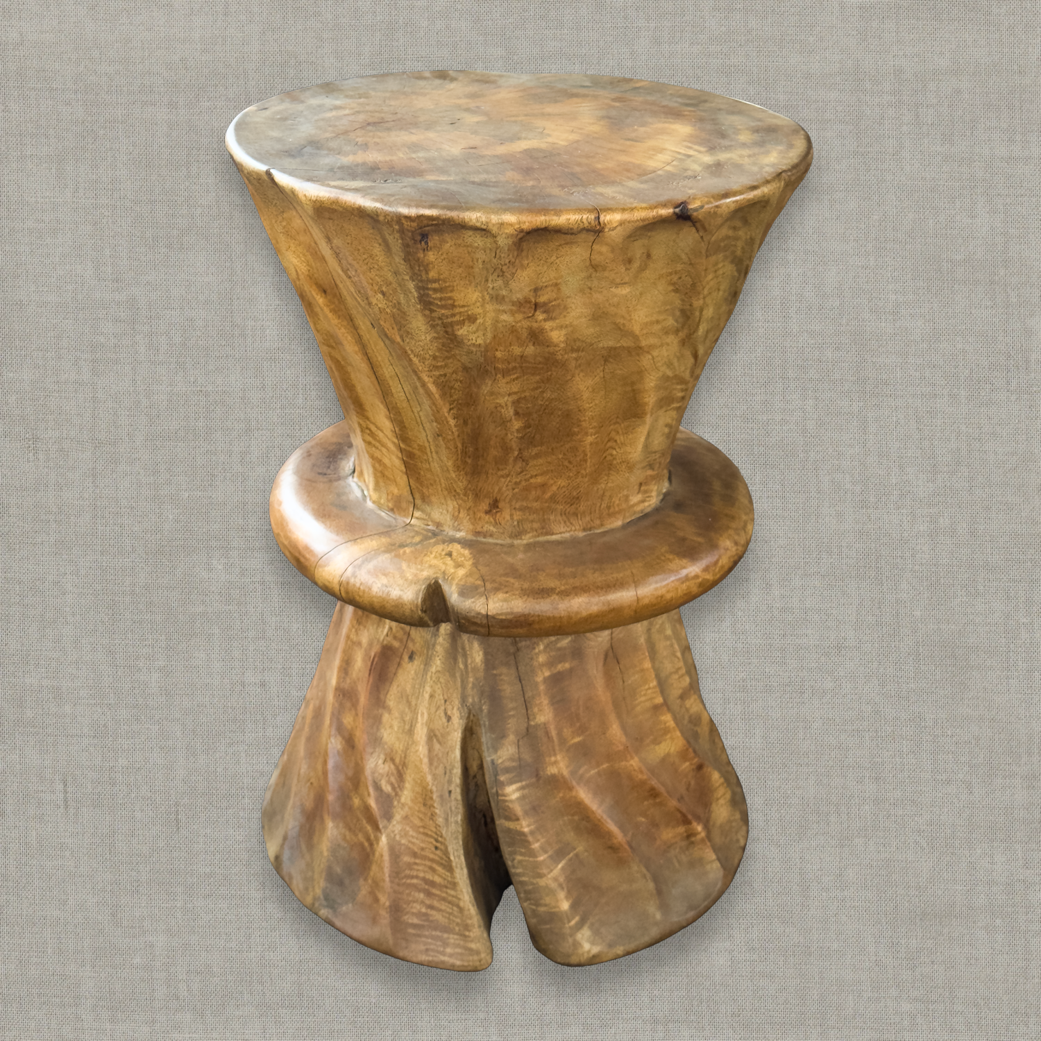 Hand carved solid mango wood sculptural pedestal table in glossy natural finish for a modern California living room