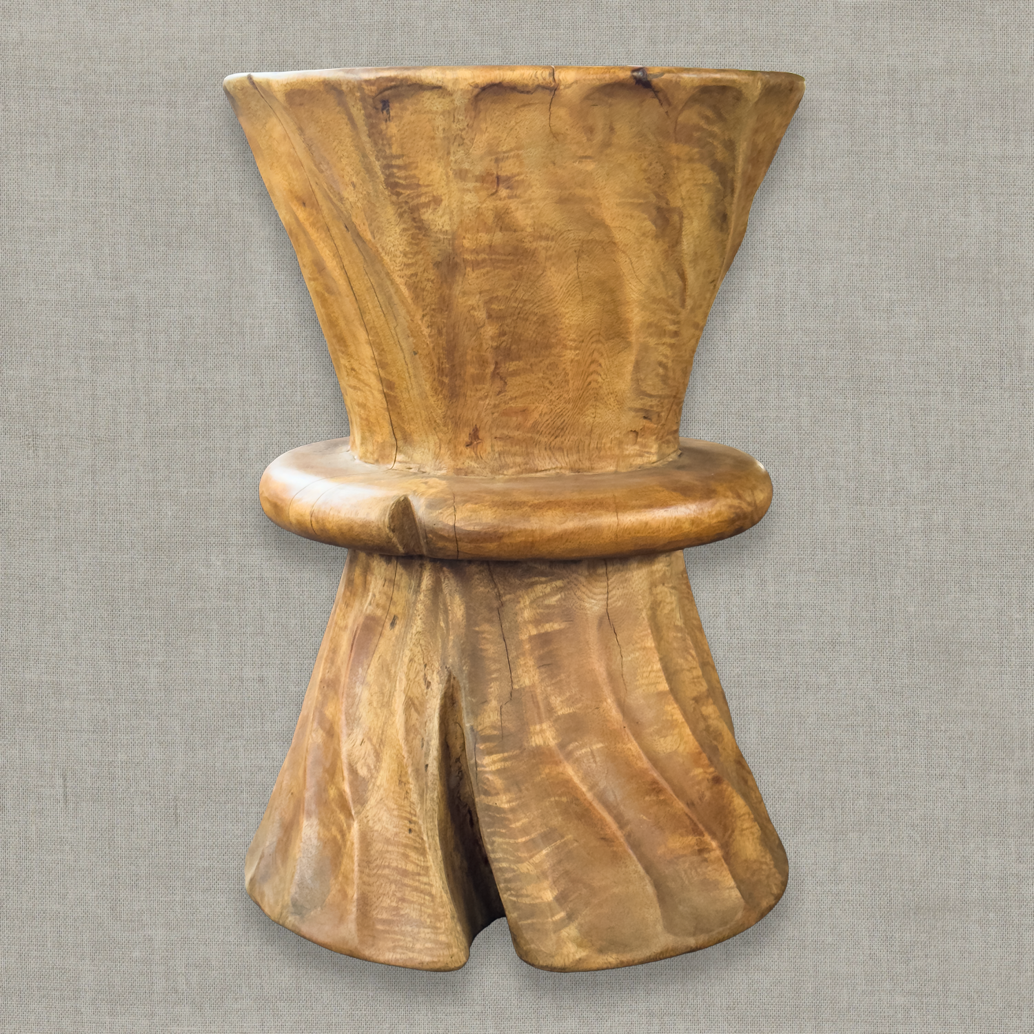 Hand carved solid mango wood sculptural pedestal table in glossy natural finish for a modern California living room
